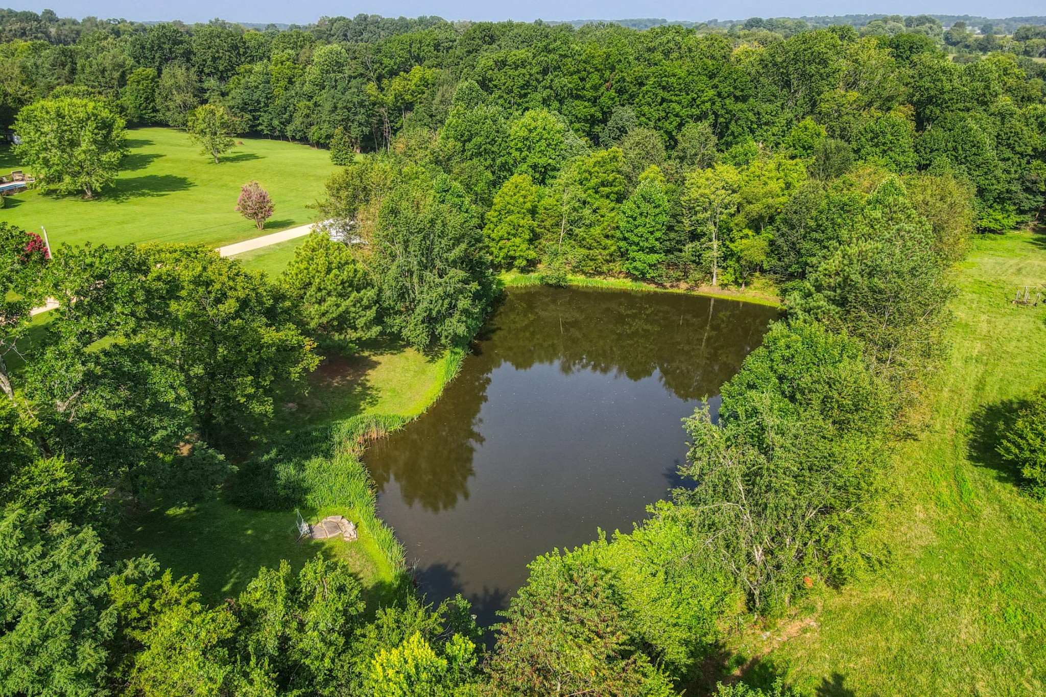 4644 East Robertson Road Cross Plains, TN 37049 - Photo 44 of 56 a view of a lake with a yard and mountain view
