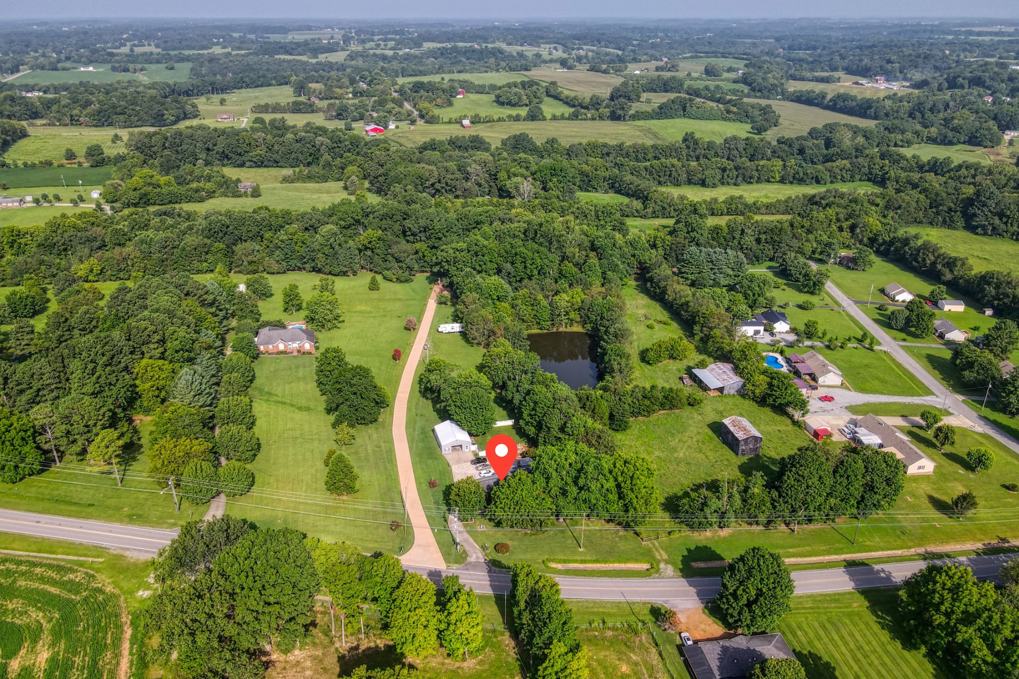 4644 East Robertson Road Cross Plains, TN 37049 - Photo 47 of 56 an aerial view of residential houses with outdoor space and trees