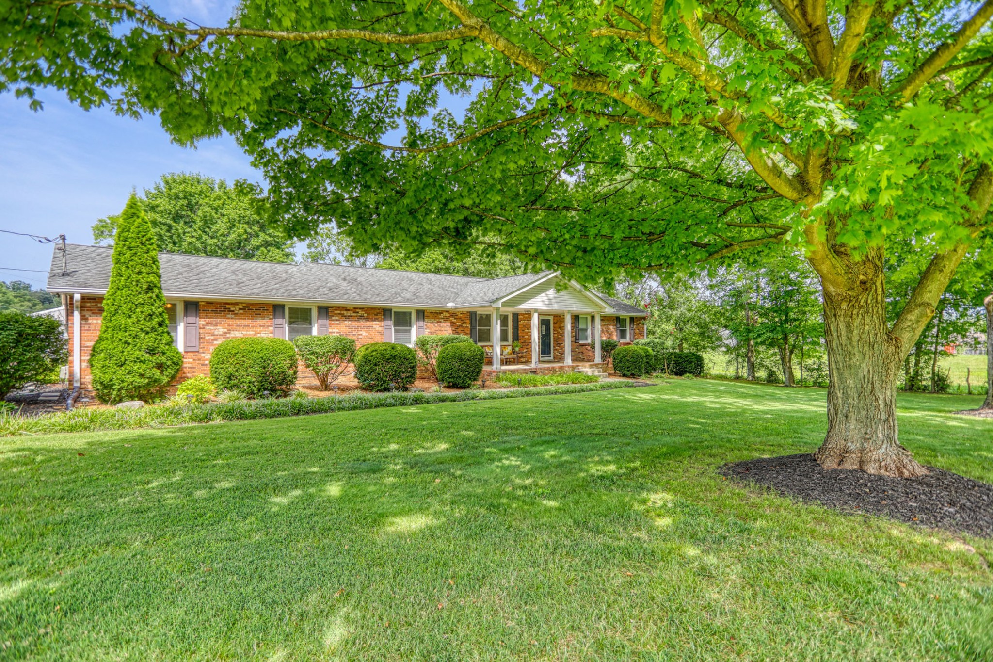 4644 East Robertson Road Cross Plains, TN 37049 - Photo 50 of 56 a front view of a house with a yard