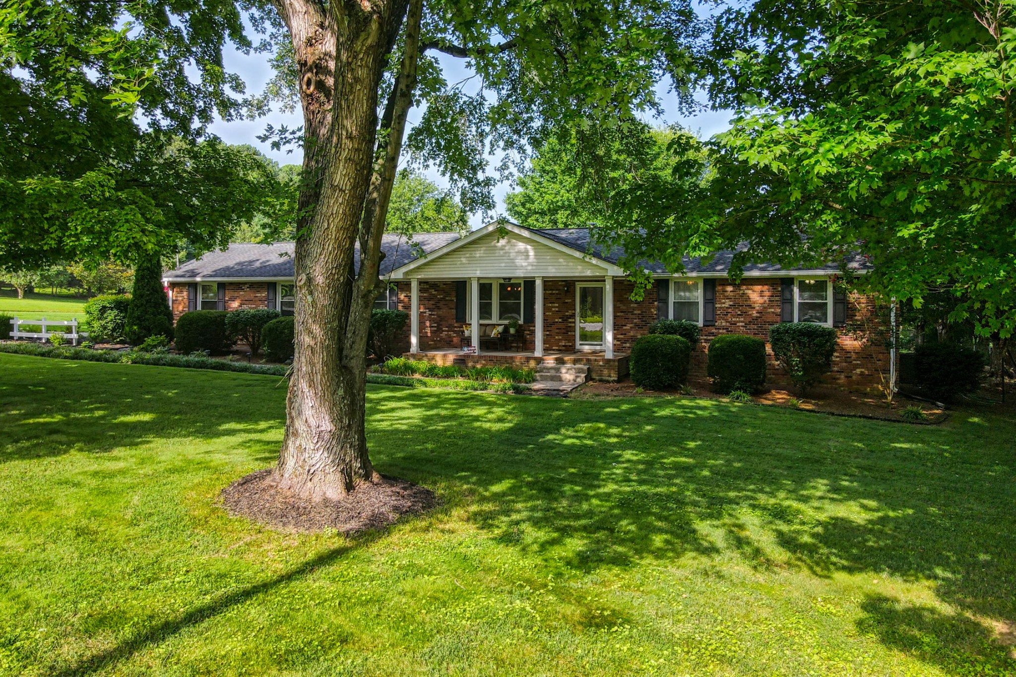 4644 East Robertson Road Cross Plains, TN 37049 - Photo 51 of 56 a front view of a house with garden