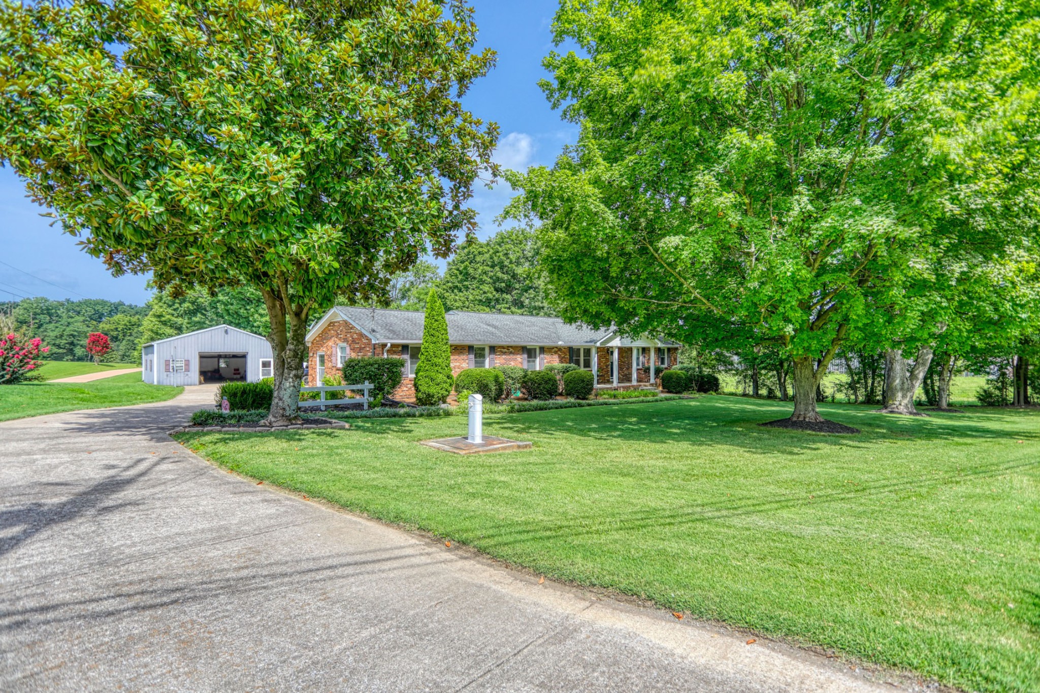 4644 East Robertson Road Cross Plains, TN 37049 - Photo 55 of 56 a front view of a house with garden