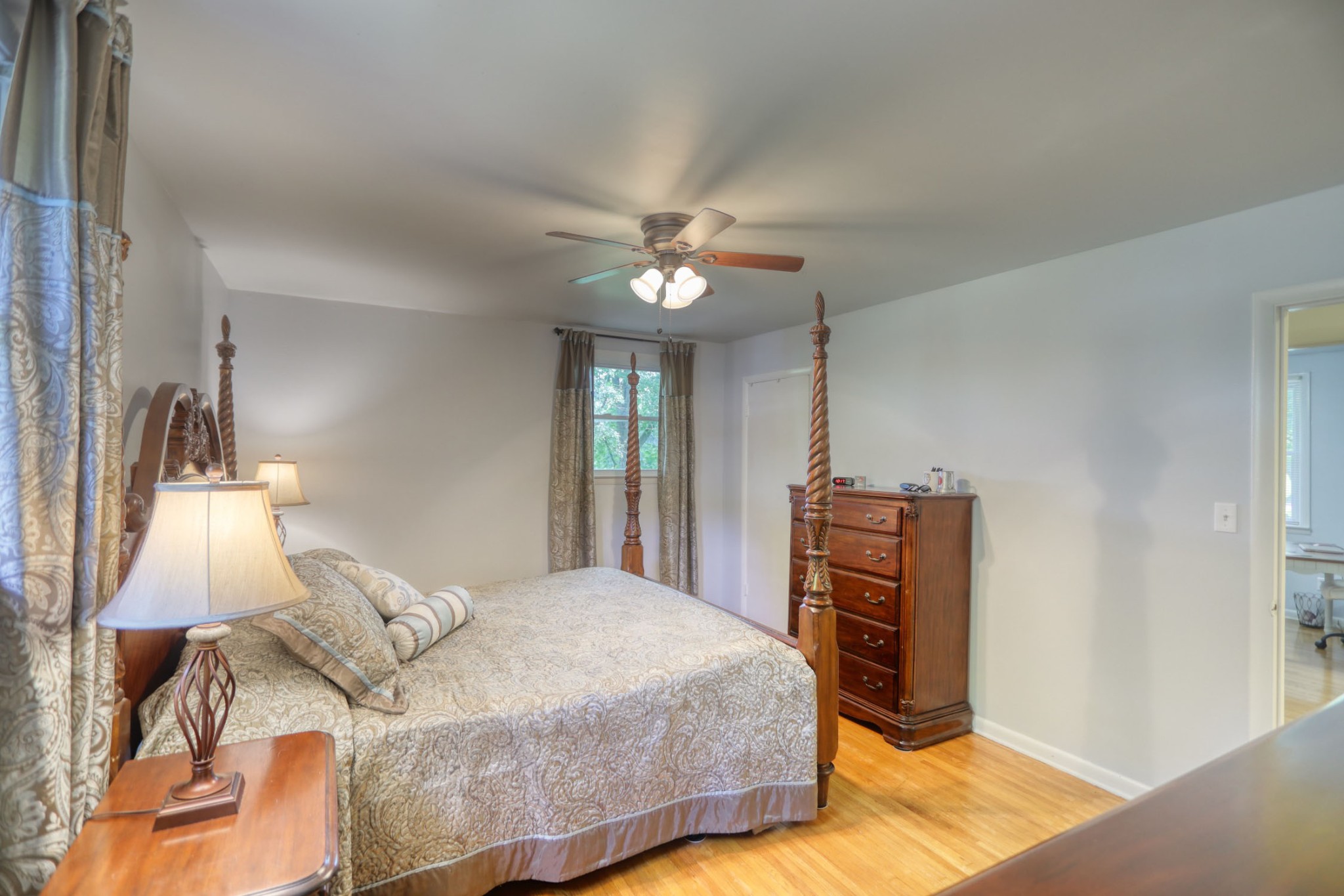 4644 East Robertson Road Cross Plains, TN 37049 - Photo 9 of 56 a bedroom with a bed and a chandelier