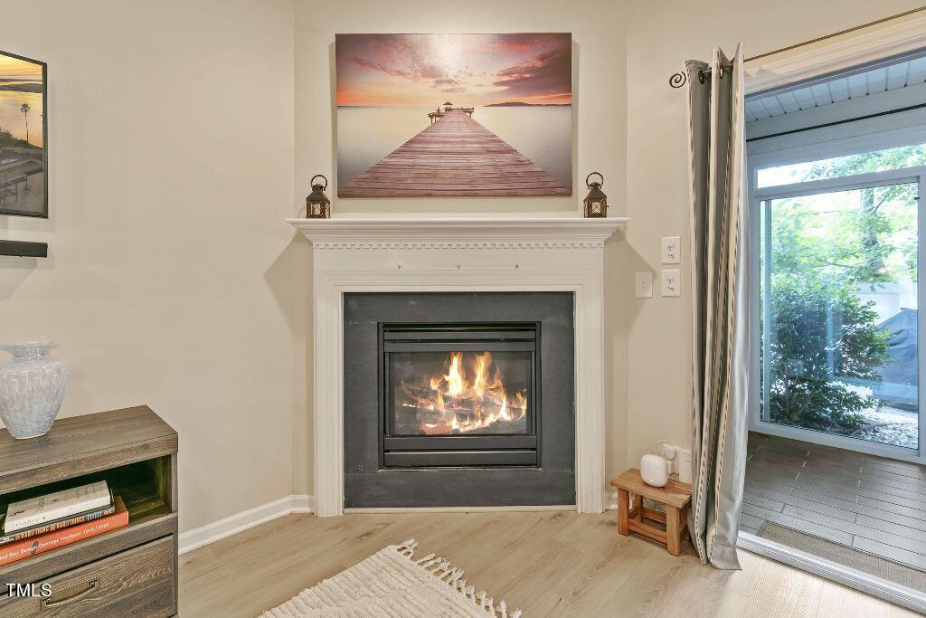 2428 Memory Ridge Drive Raleigh, NC 27606 - Photo 15 of 36 a living room with a fireplace and a fireplace
