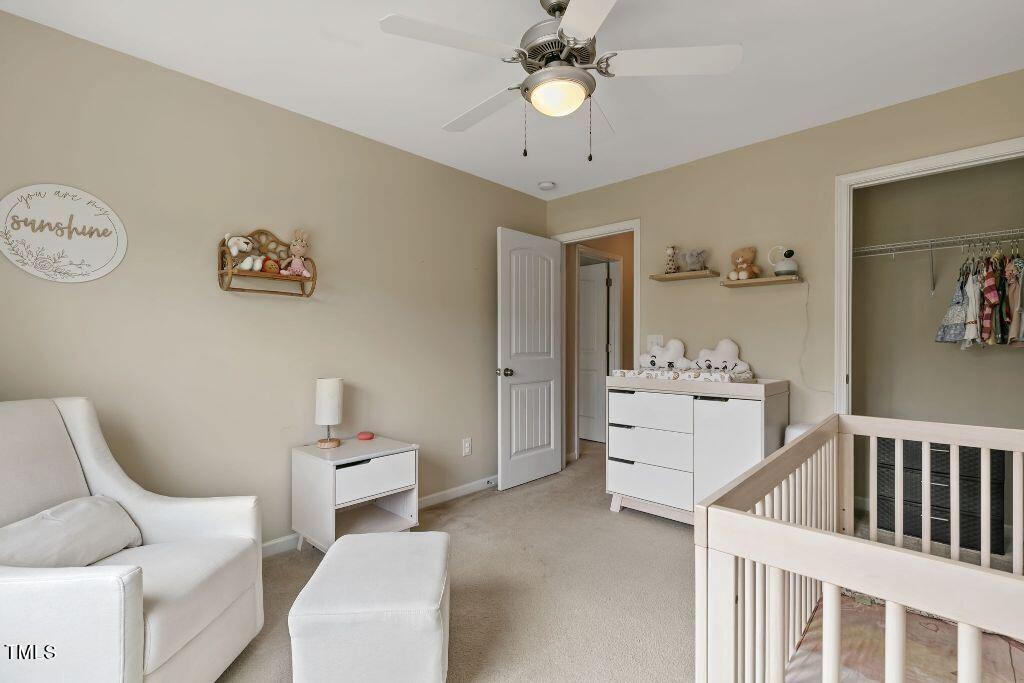 2428 Memory Ridge Drive Raleigh, NC 27606 - Photo 27 of 36 a living room with furniture and white walls