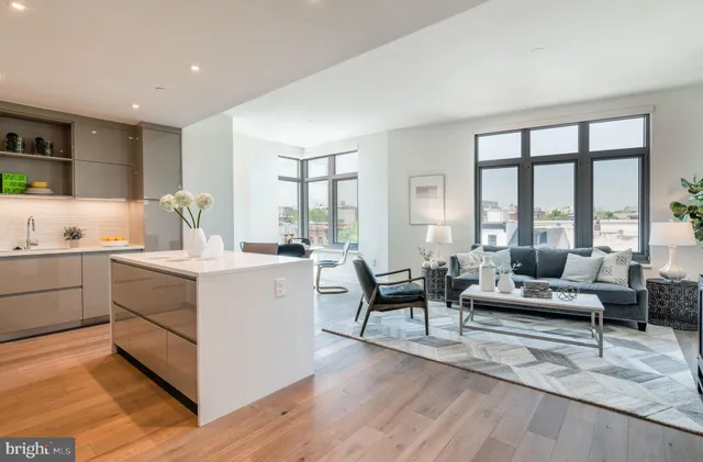 a kitchen with sink and cabinets