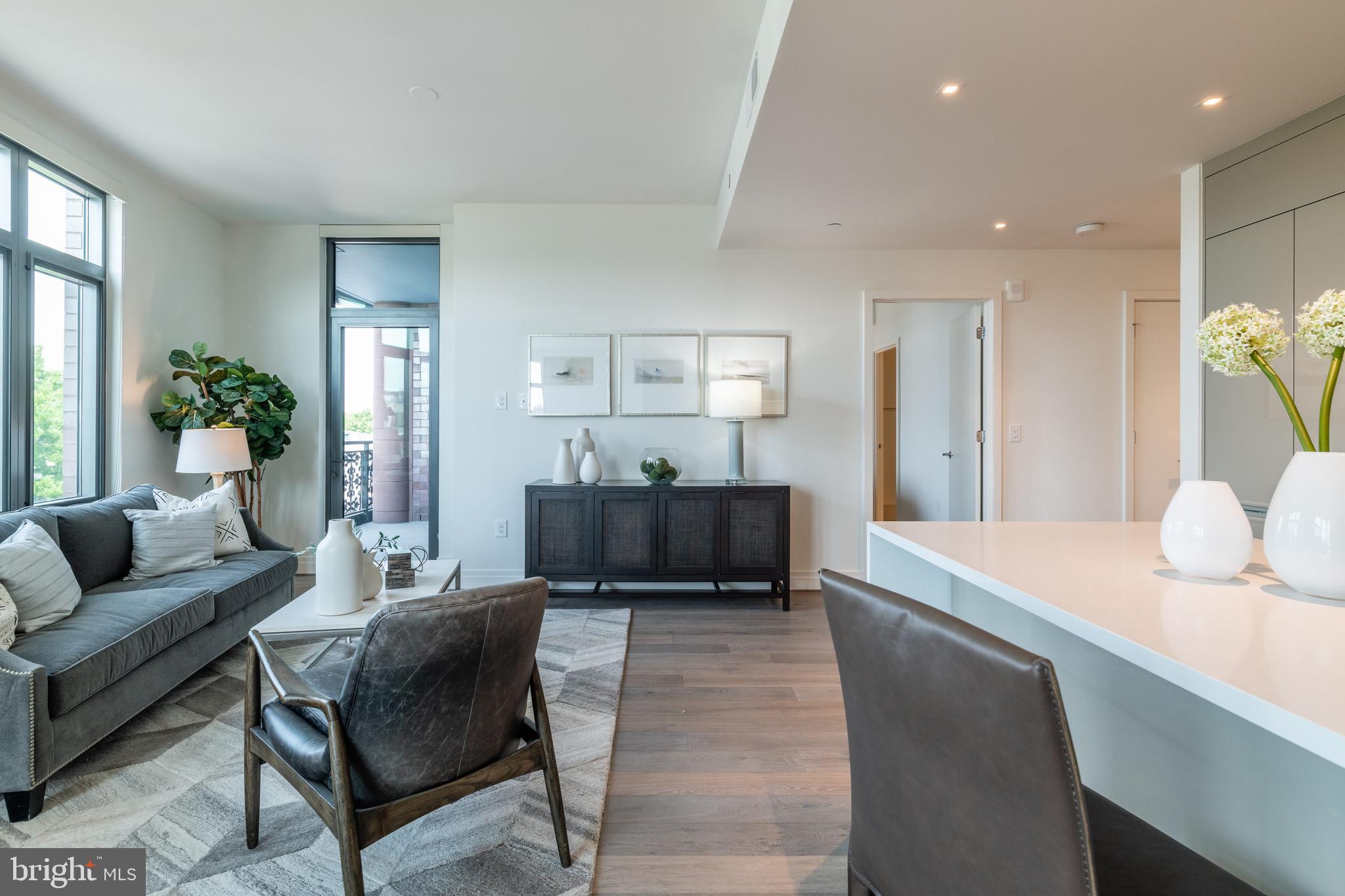 810 O Street Northwest, Unit 706 Washington, DC 20001 - Photo 16 of 48 a living room with furniture and a table