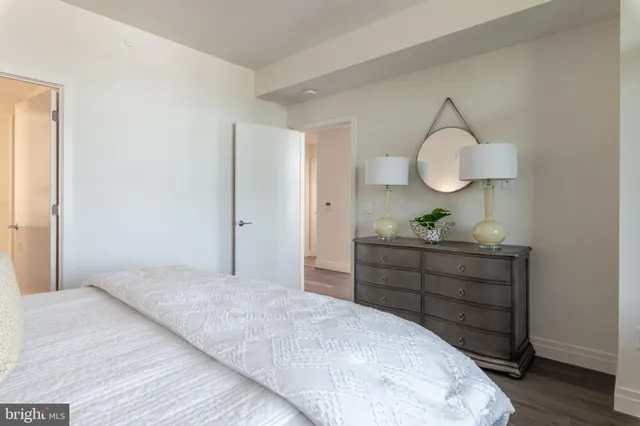 a bedroom with a bed and a dresser