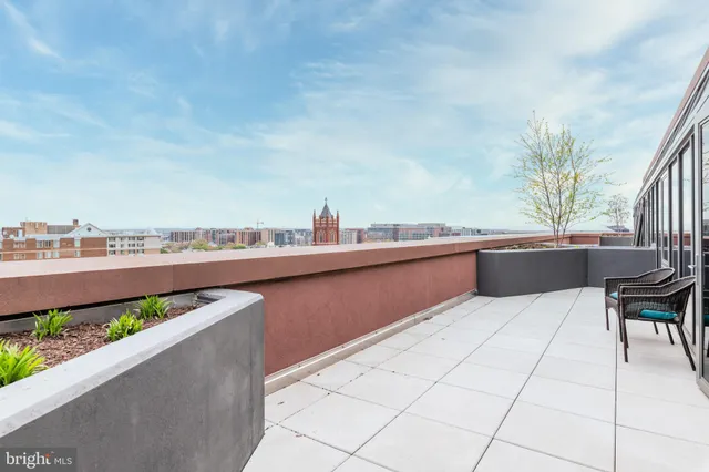 a terrace with a table and chairs