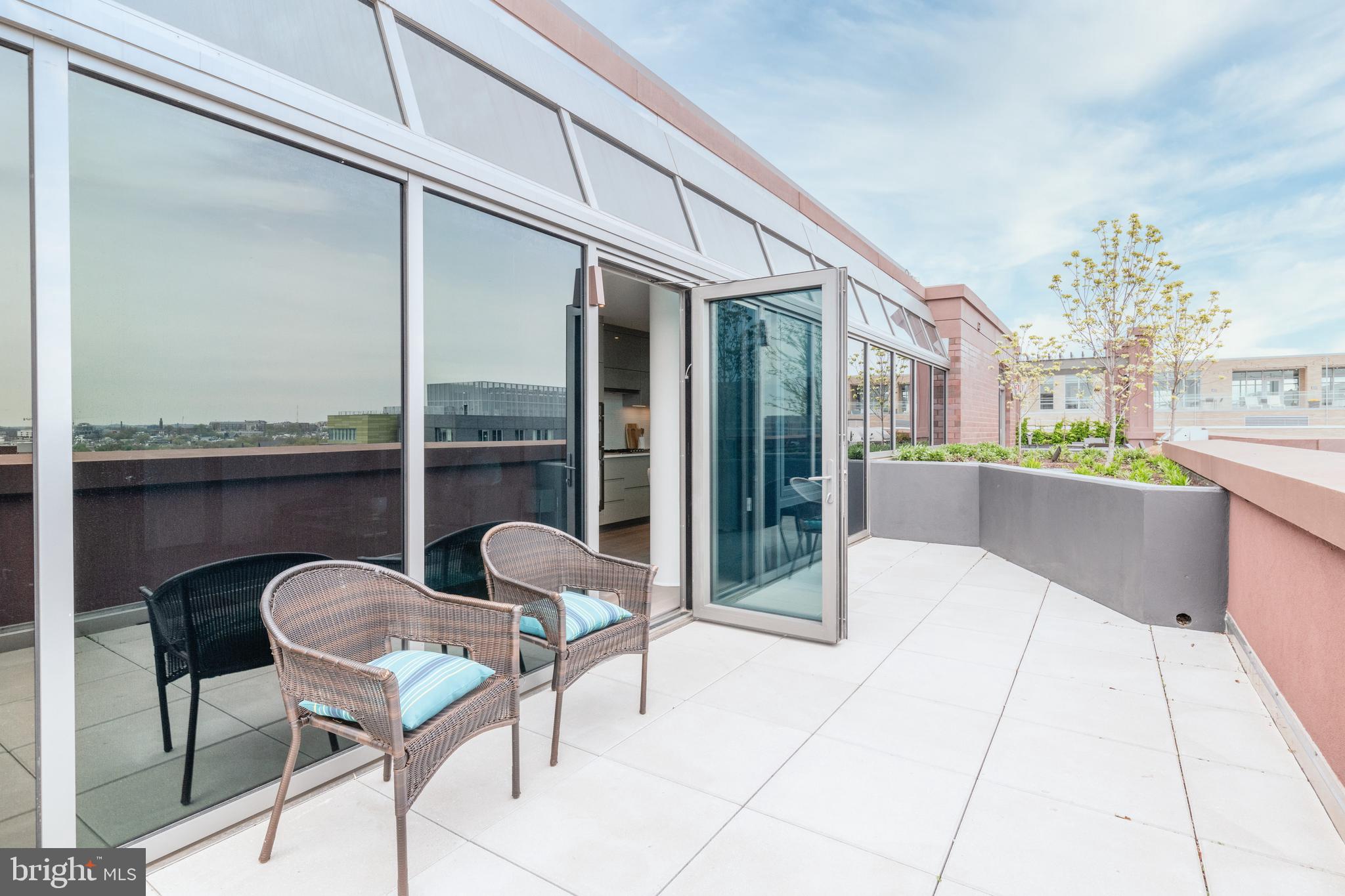 810 O Street Northwest, Unit 706 Washington, DC 20001 - Photo 43 of 48 a view of a chairs and table in the balcony