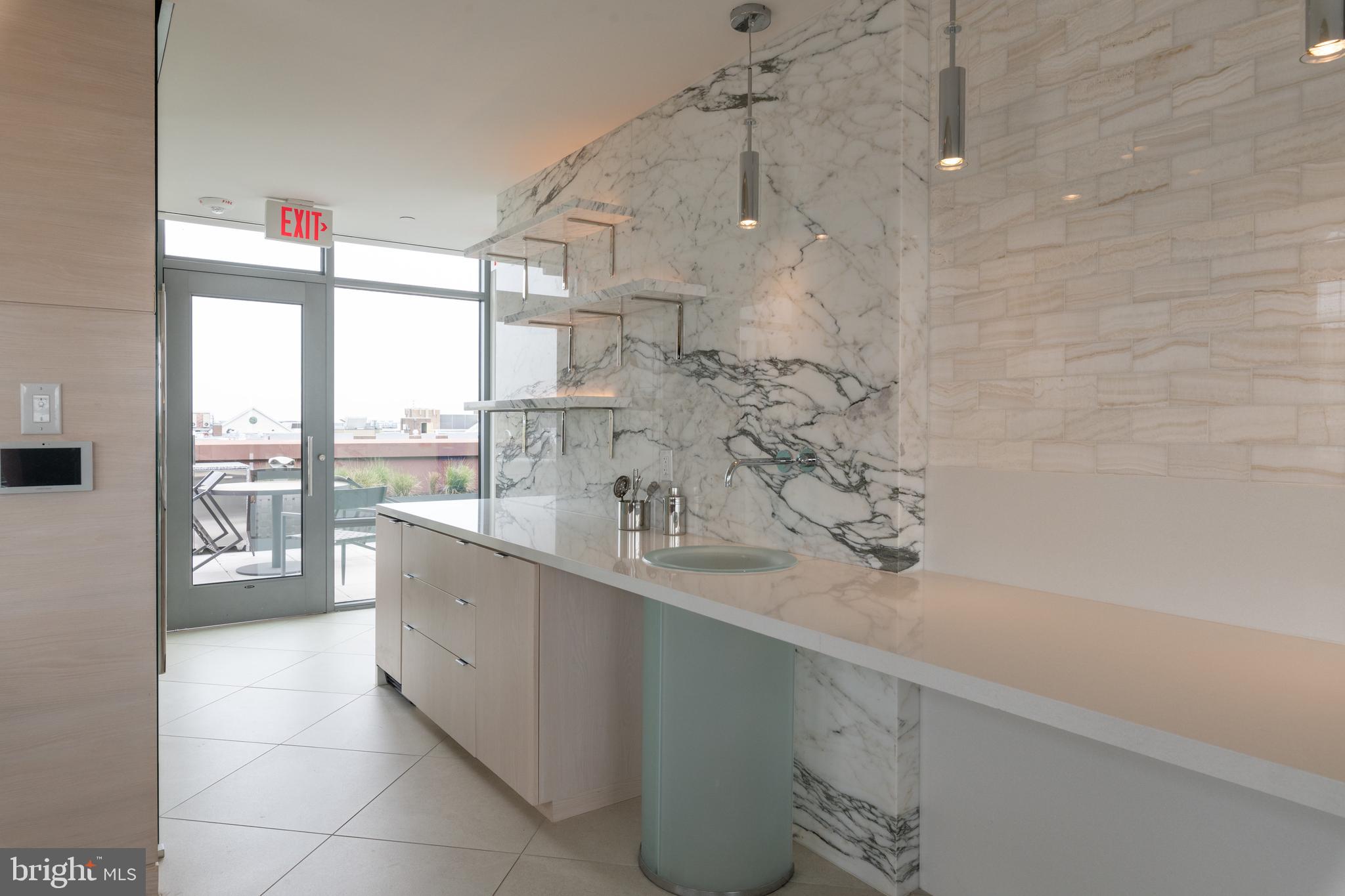 810 O Street Northwest, Unit 706 Washington, DC 20001 - Photo 46 of 48 a large white kitchen with a large window