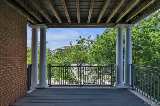 a view of a porch with wooden floor