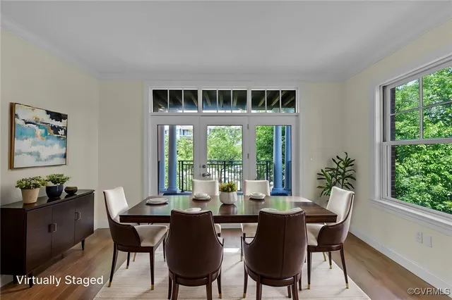 a view of a dining room with furniture window and outside view