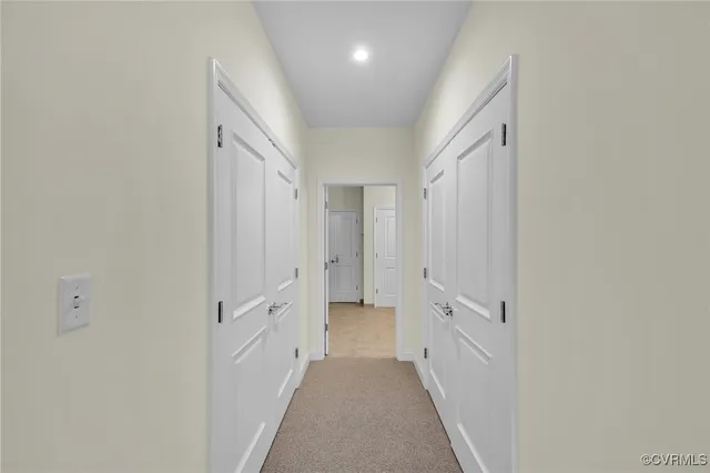 a view of a hallway with white walls
