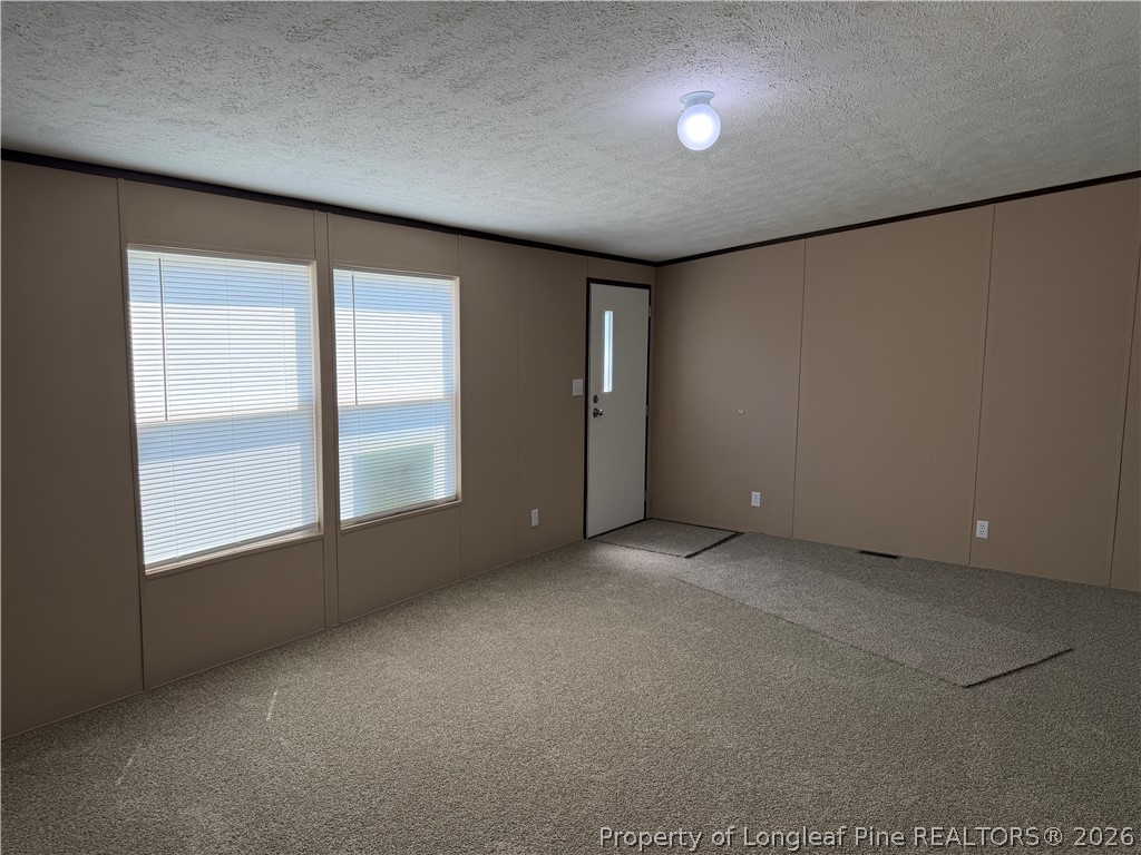 4339 Saddletree Road Lumberton, NC 28360 - Photo 14 of 23 an empty room with a empty space and windows