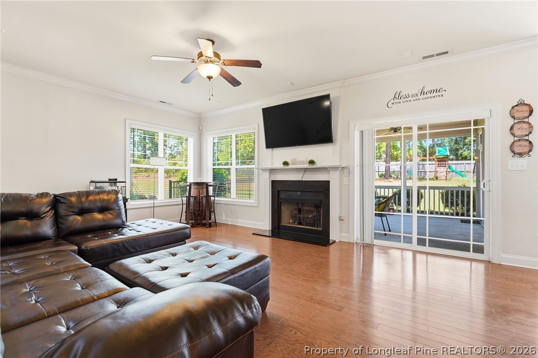 886 Micahs Way North Spring Lake, NC 28390 - Photo 14 of 50 a living room with furniture fireplace and flat screen tv