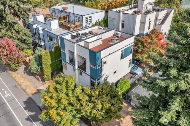 a aerial view of a house with a yard and garden