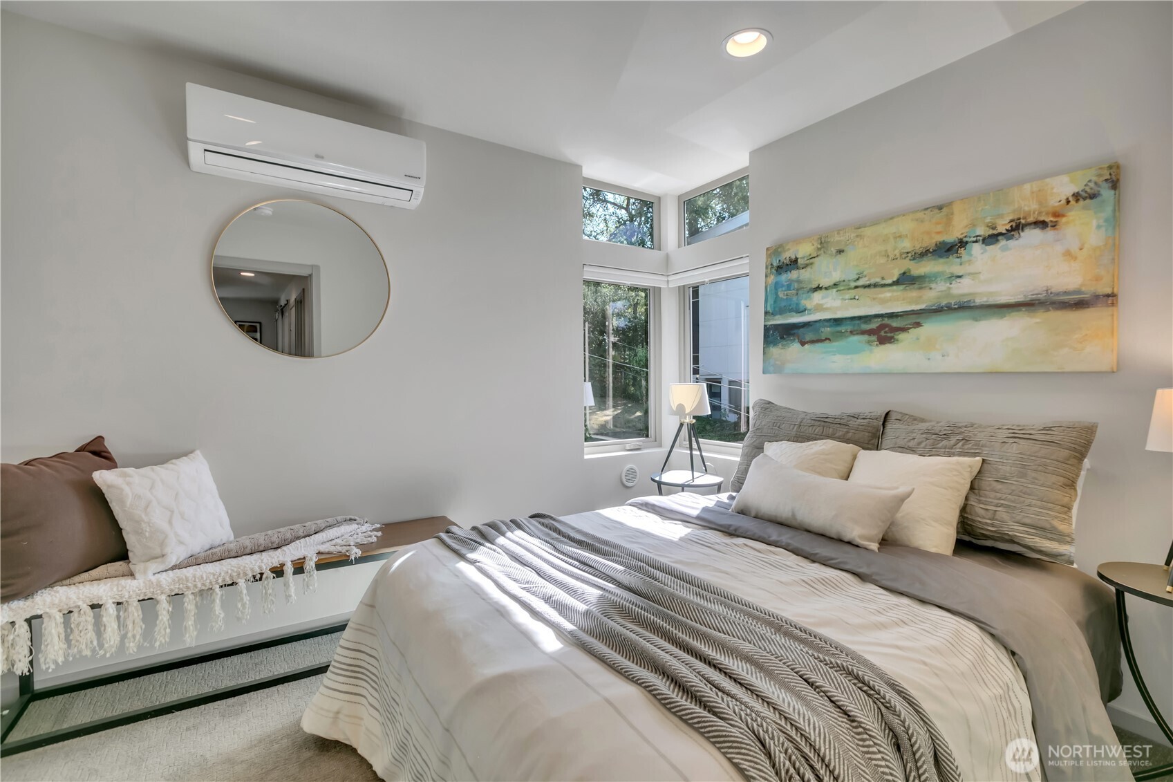 5008 Fauntleroy Way Southwest, Unit B Seattle, WA 98136 - Photo 17 of 36 a bedroom with a bed and a mirror