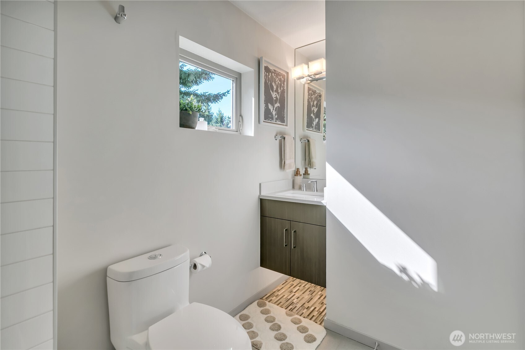 5008 Fauntleroy Way Southwest, Unit B Seattle, WA 98136 - Photo 19 of 36 a bathroom with a bathtub sink and toilet