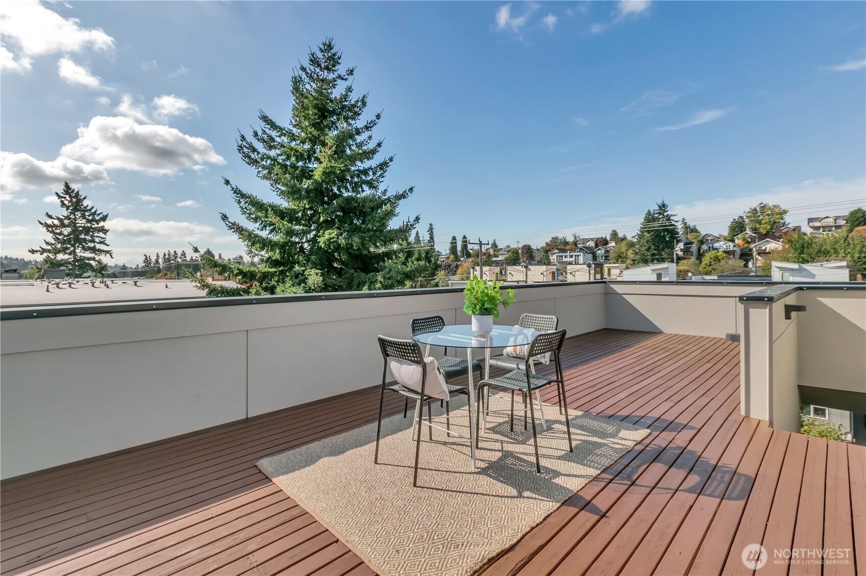 5008 Fauntleroy Way Southwest, Unit B Seattle, WA 98136 - Photo 26 of 36 a patio with wooden floor and outdoor seating