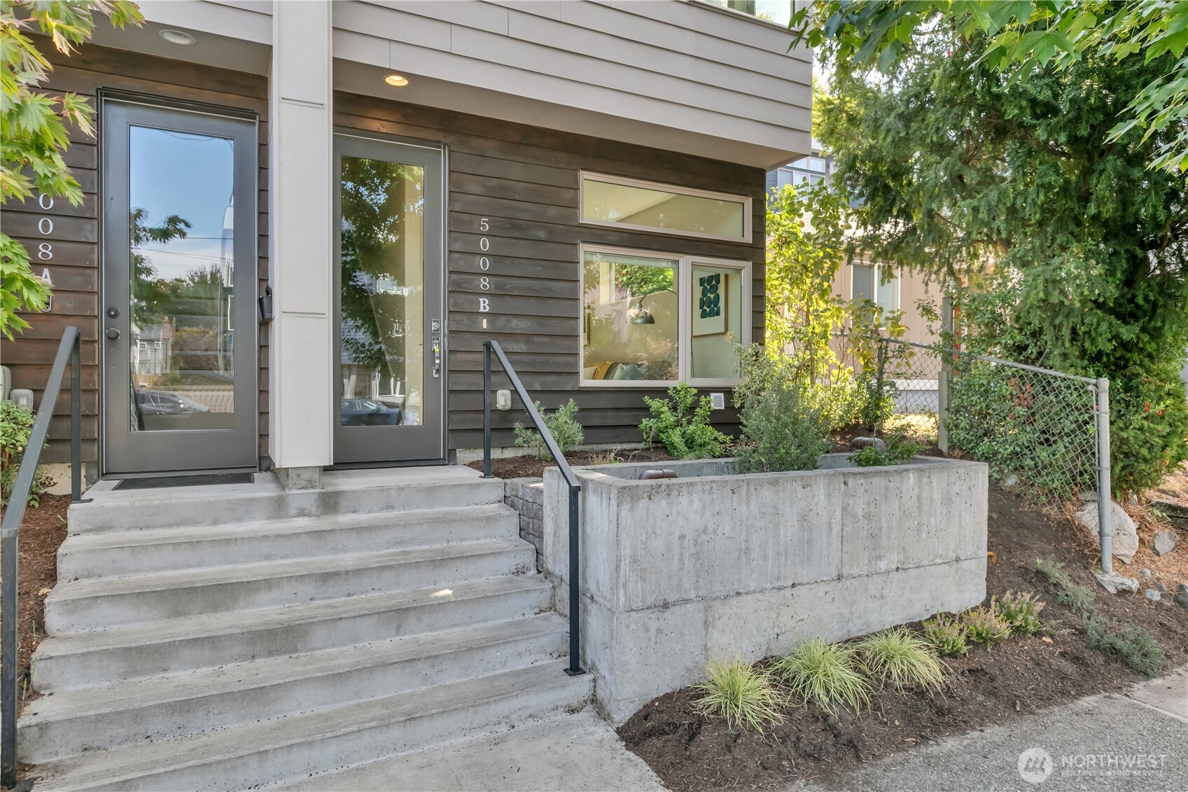 5008 Fauntleroy Way Southwest, Unit B Seattle, WA 98136 - Photo 30 of 36 a front view of a house with plants