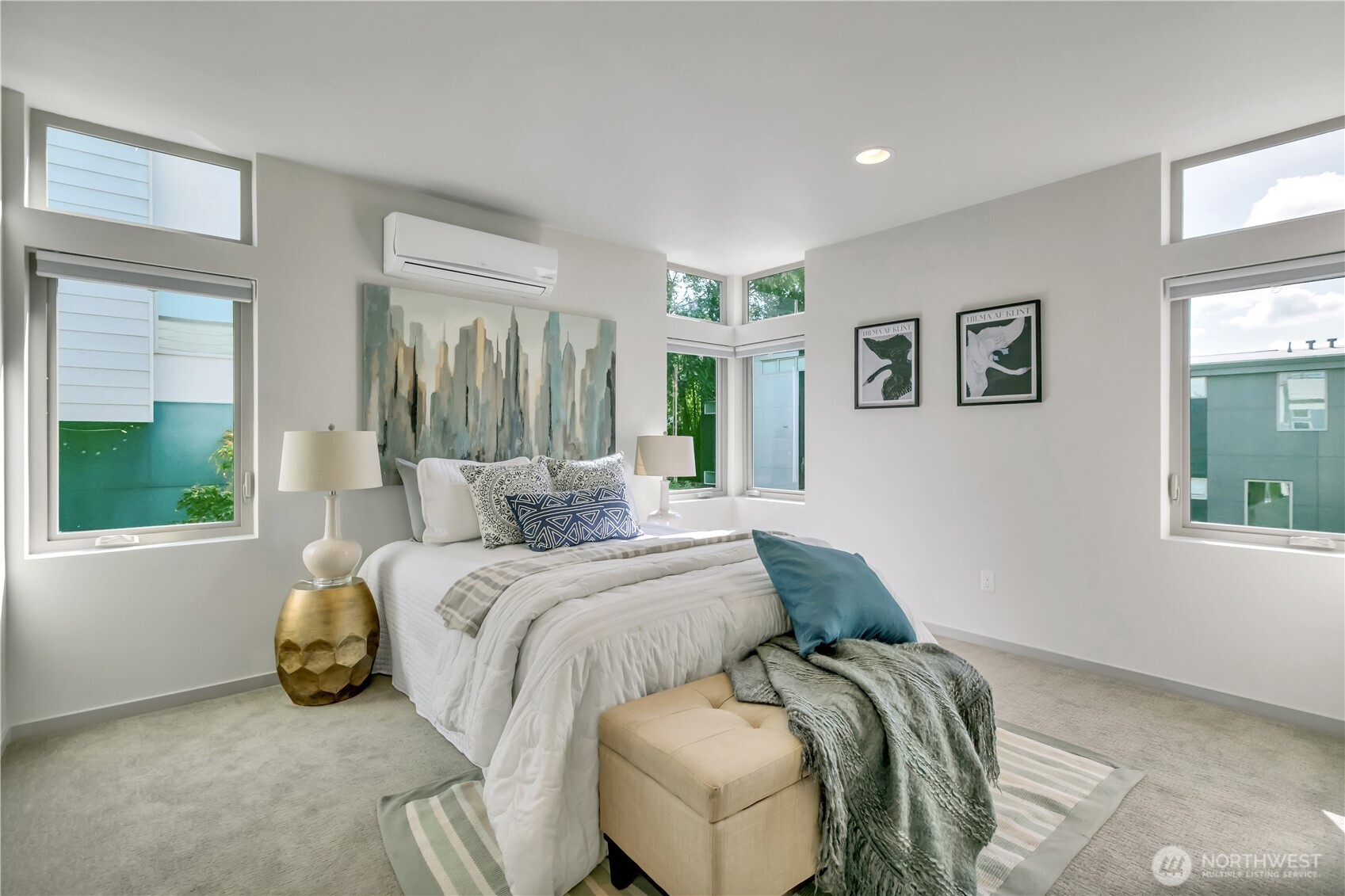 5008 Fauntleroy Way Southwest, Unit B Seattle, WA 98136 - Photo 4 of 36 a bed sitting in a bedroom next to a window