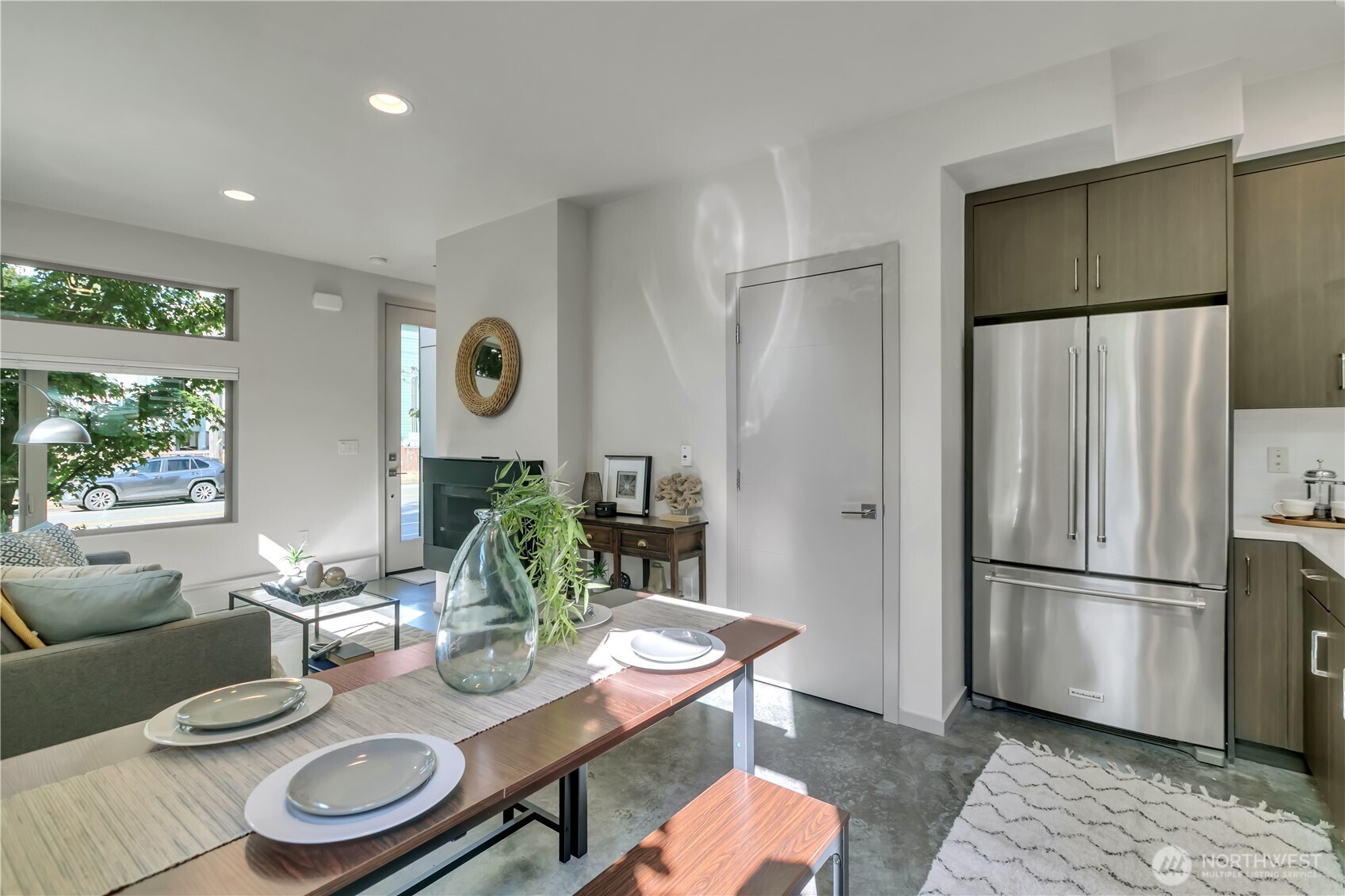 5008 Fauntleroy Way Southwest, Unit B Seattle, WA 98136 - Photo 7 of 36 a dining room with furniture a rug and wooden floor