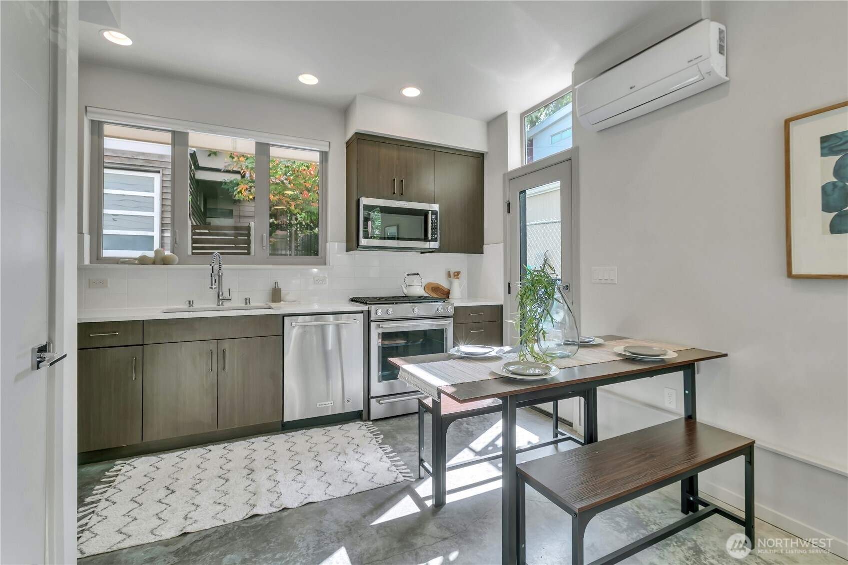 5008 Fauntleroy Way Southwest, Unit B Seattle, WA 98136 - Photo 9 of 36 a kitchen with a stove a sink and a refrigerator
