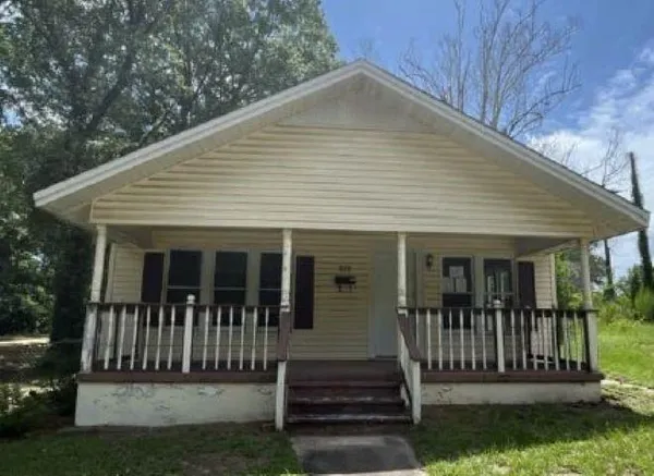 a front view of a house with a porch