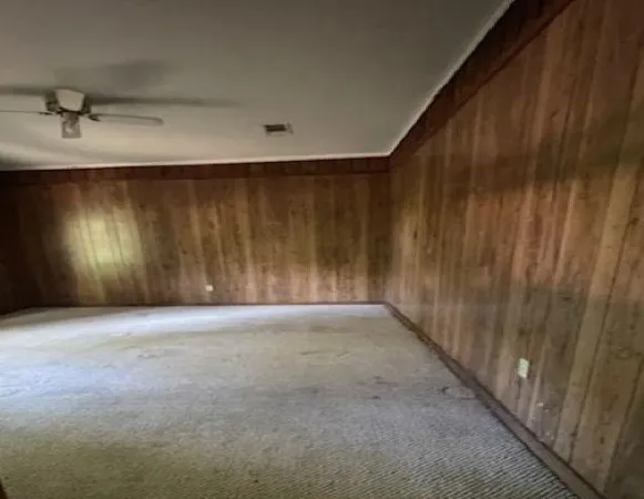 a bath room with a toilet and a bath tub