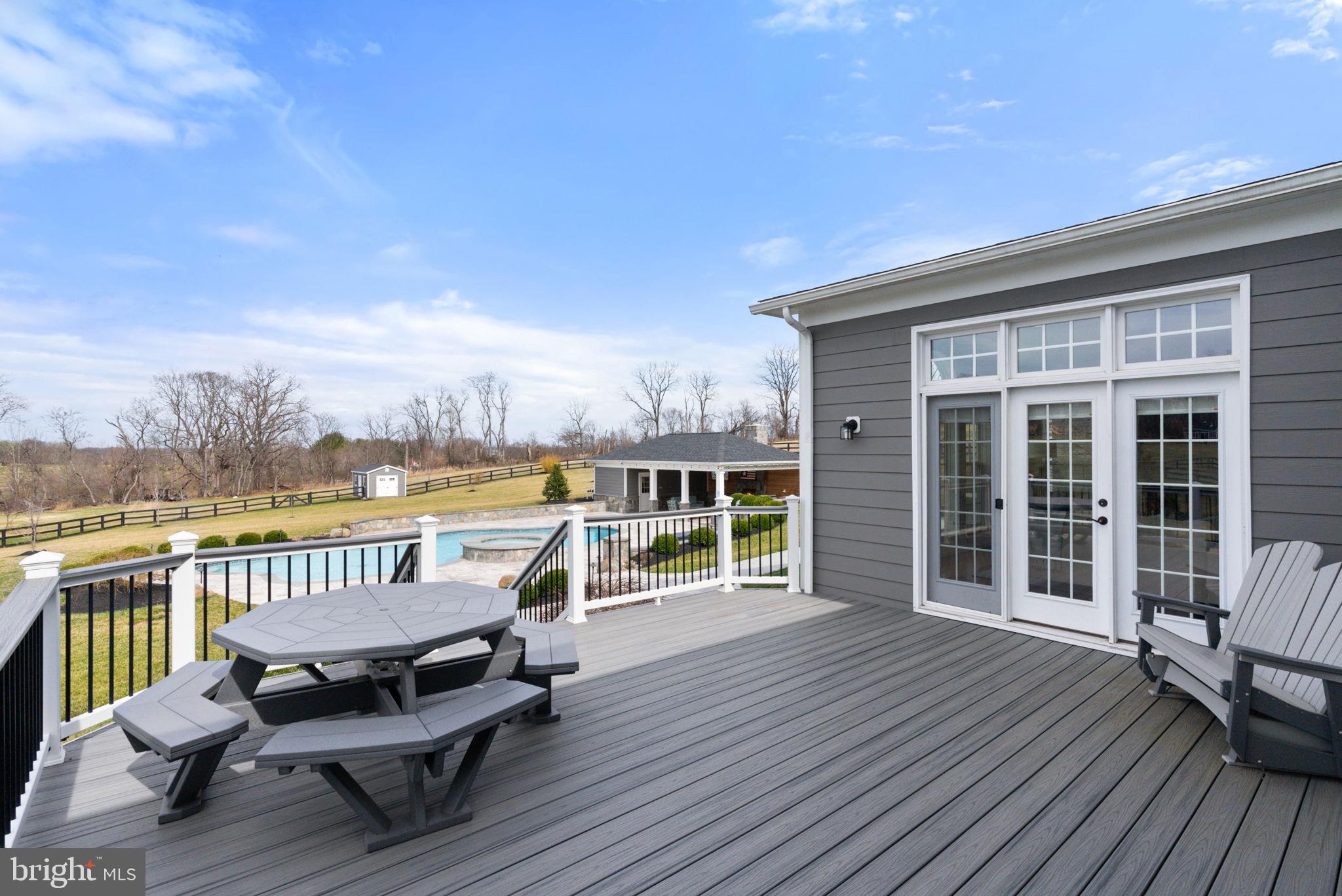 18482 Wild Raspberry Drive Purcellville, VA 20132 - Photo 103 of 143 back deck of main house facing doors to sun room