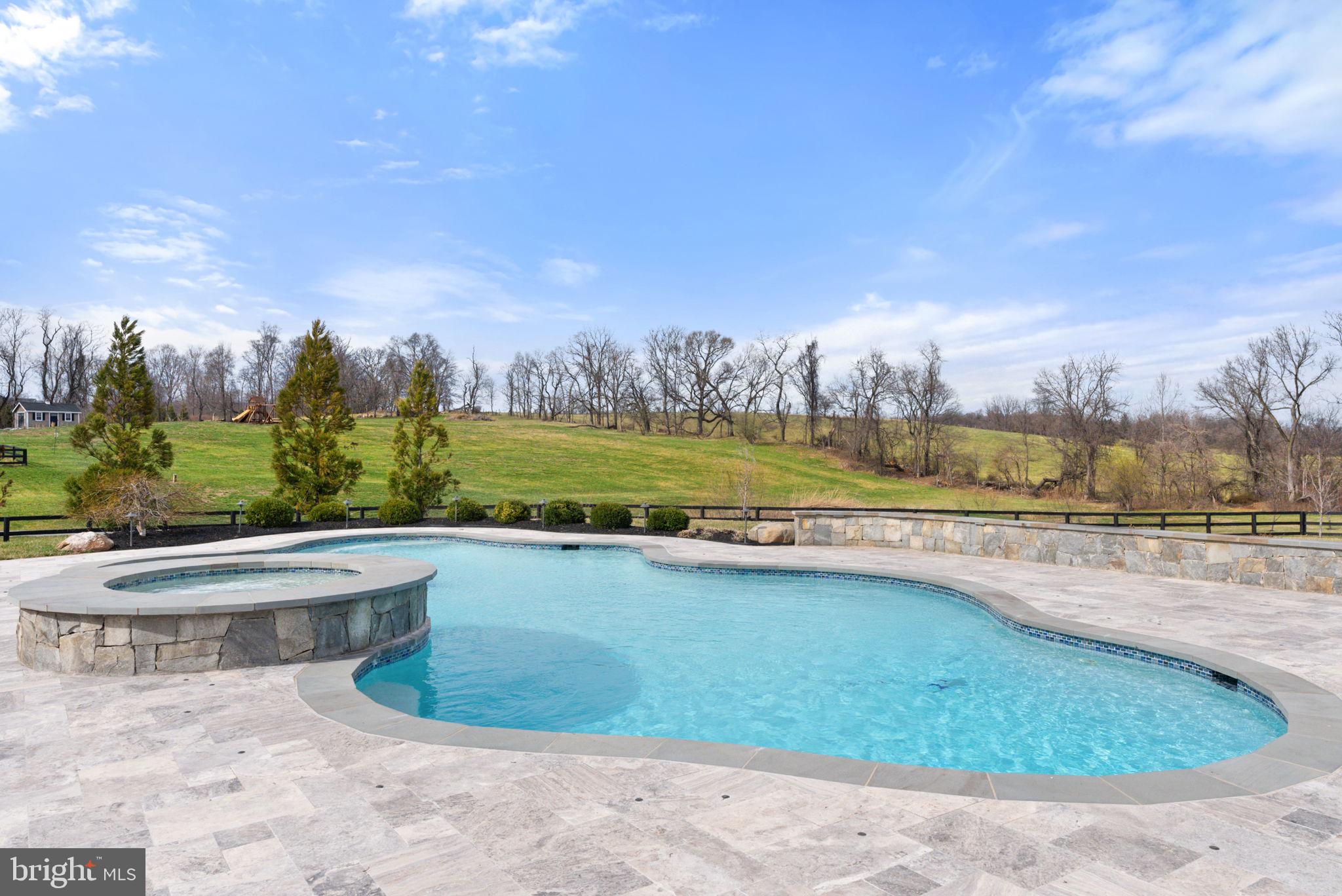 18482 Wild Raspberry Drive Purcellville, VA 20132 - Photo 107 of 143 a view of a swimming pool and an outdoor space