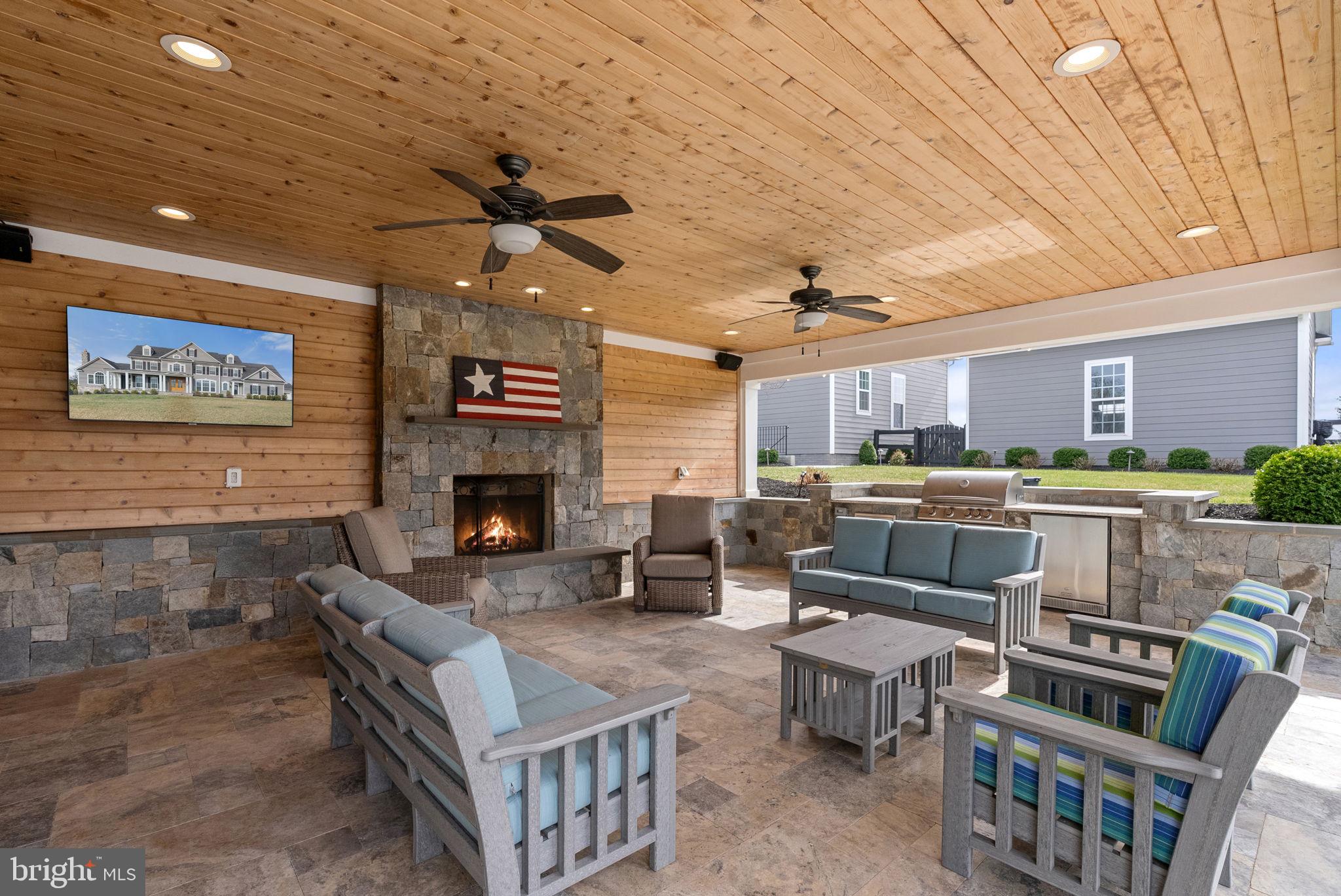 18482 Wild Raspberry Drive Purcellville, VA 20132 - Photo 109 of 143 a living room with furniture and a fireplace