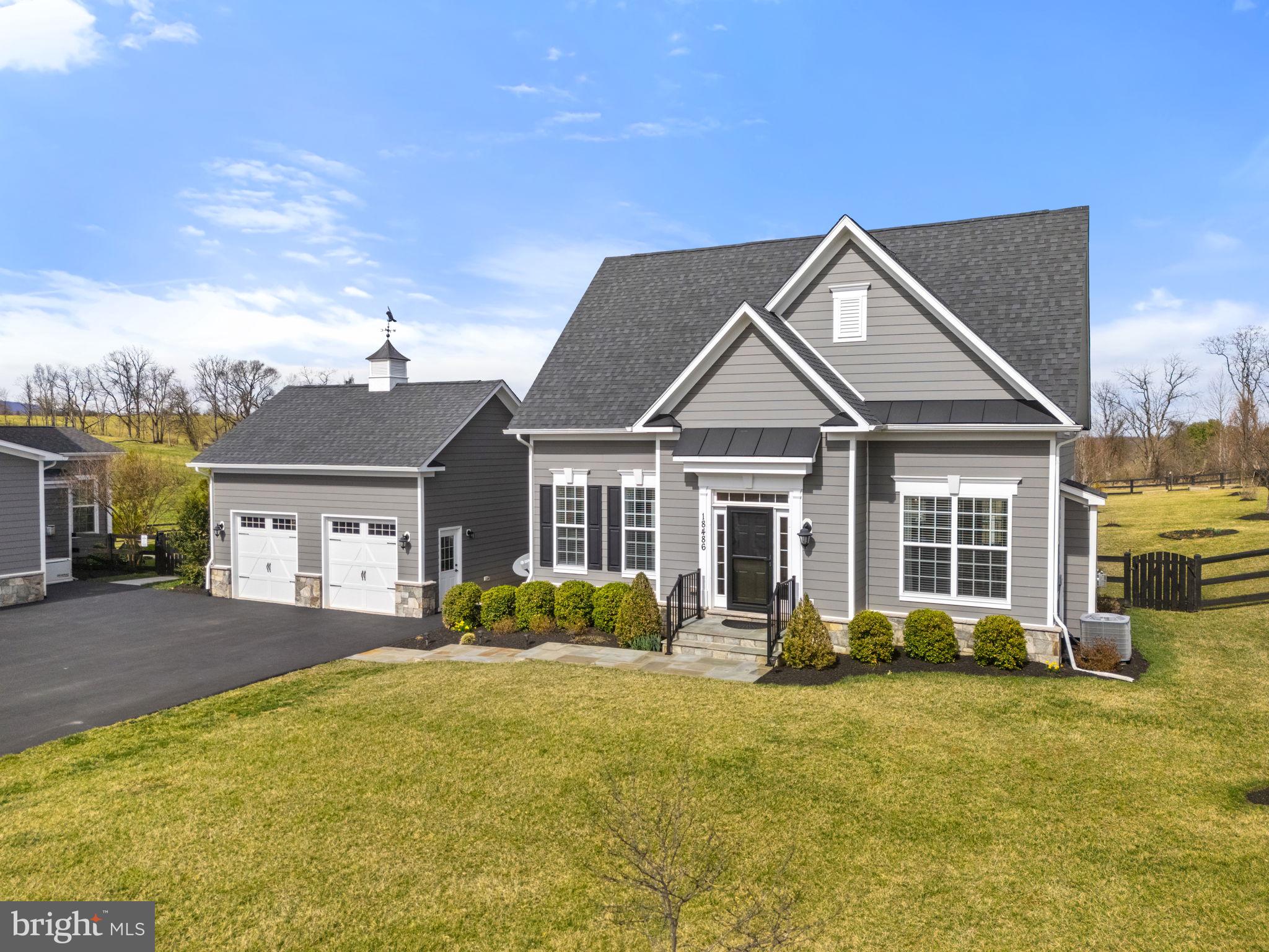 18482 Wild Raspberry Drive Purcellville, VA 20132 - Photo 113 of 143 a front view of a house with a lots of trees