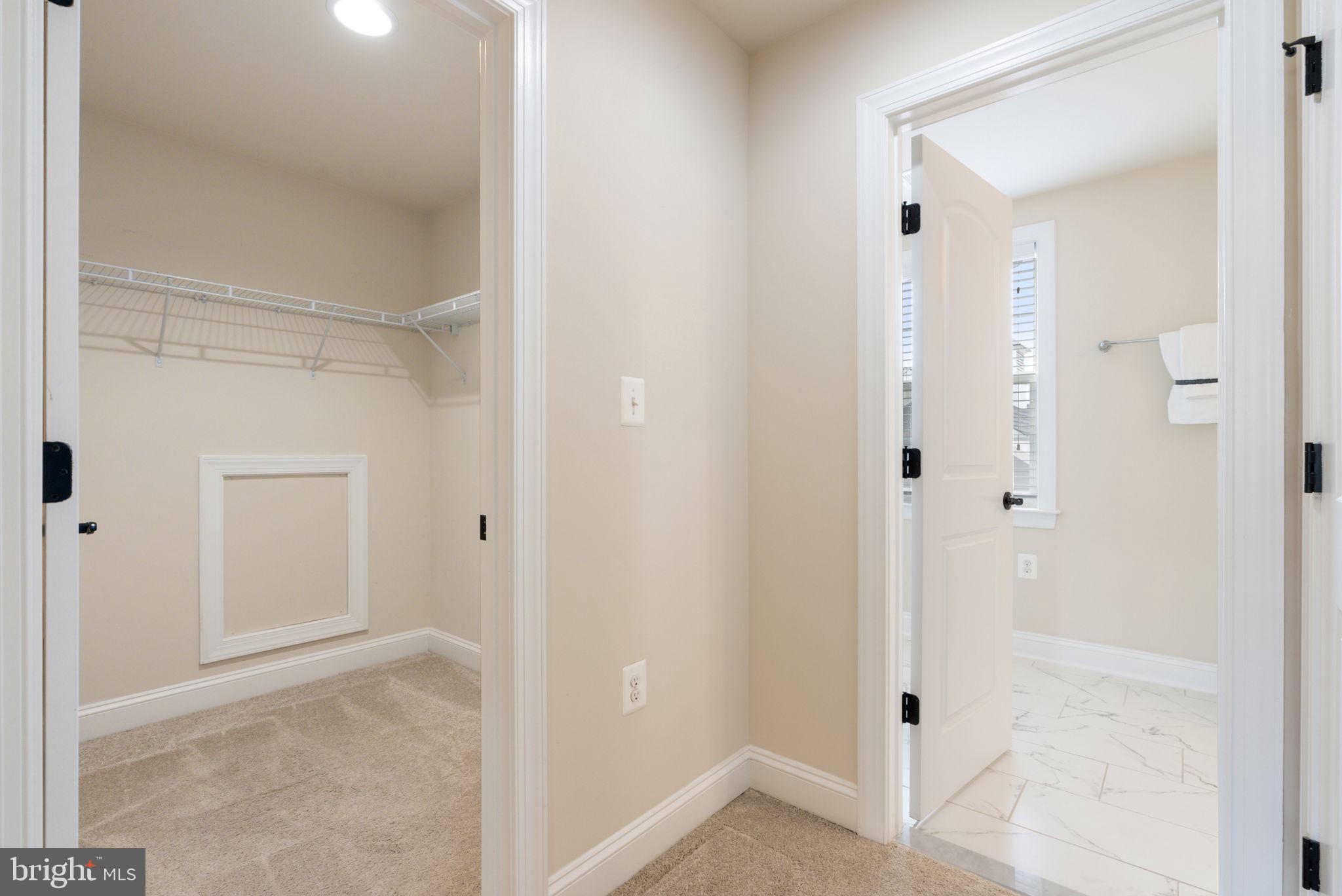 18482 Wild Raspberry Drive Purcellville, VA 20132 - Photo 127 of 143 a view of a bathroom with a glass shower door