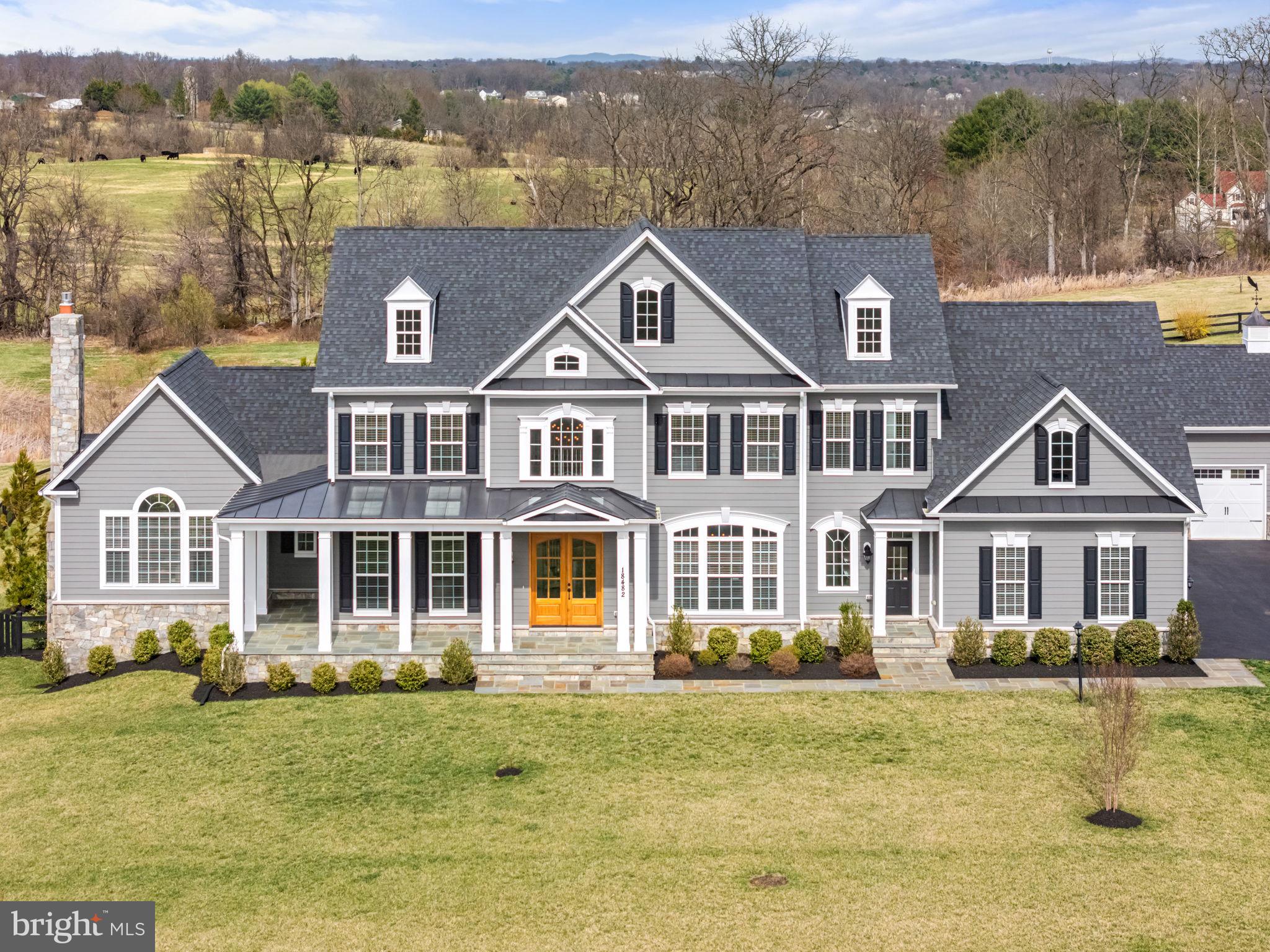 18482 Wild Raspberry Drive Purcellville, VA 20132 - Photo 19 of 143 a front view of a house with a yard