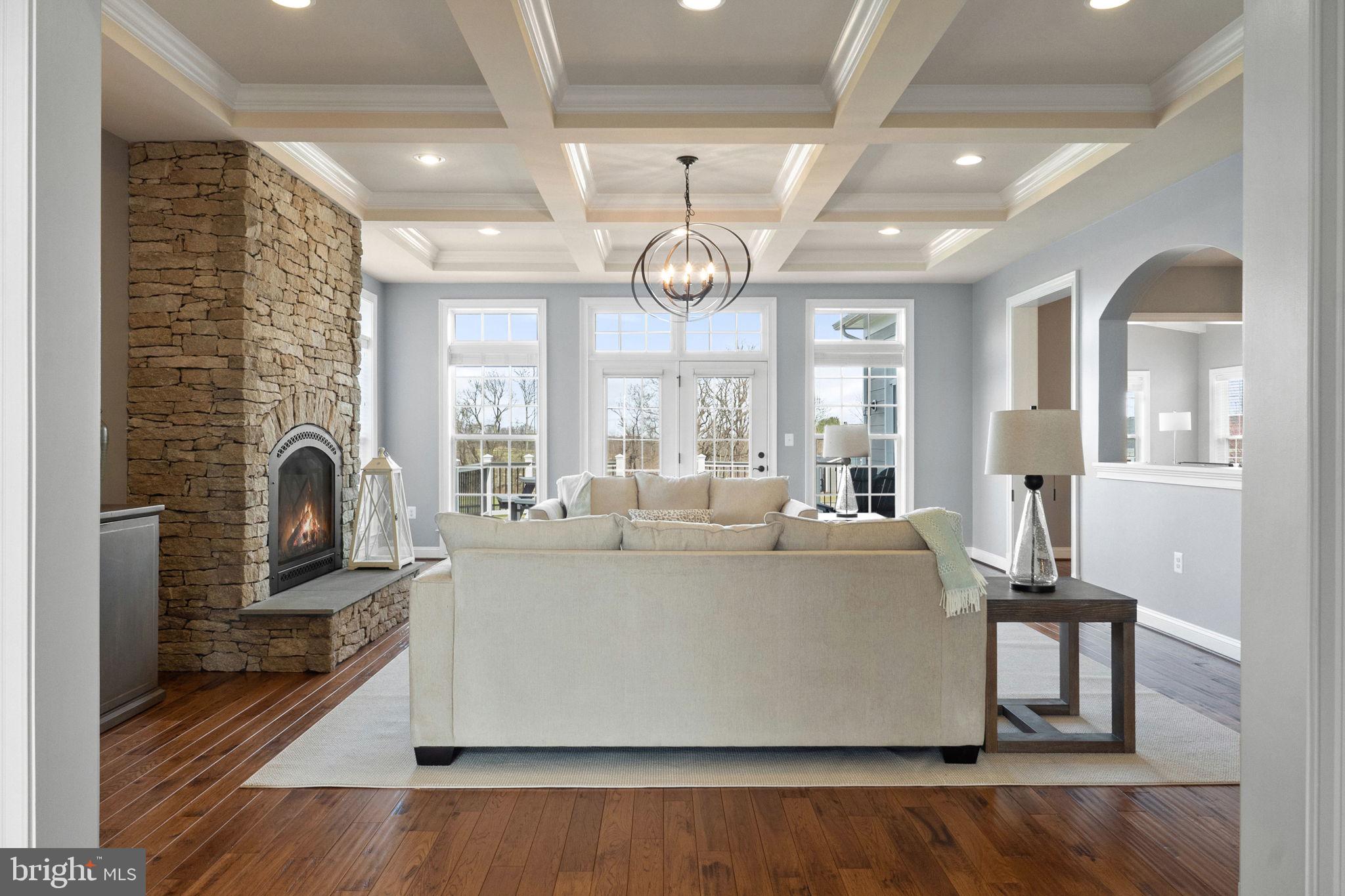 18482 Wild Raspberry Drive Purcellville, VA 20132 - Photo 39 of 143 a living room with fireplace furniture and a large window