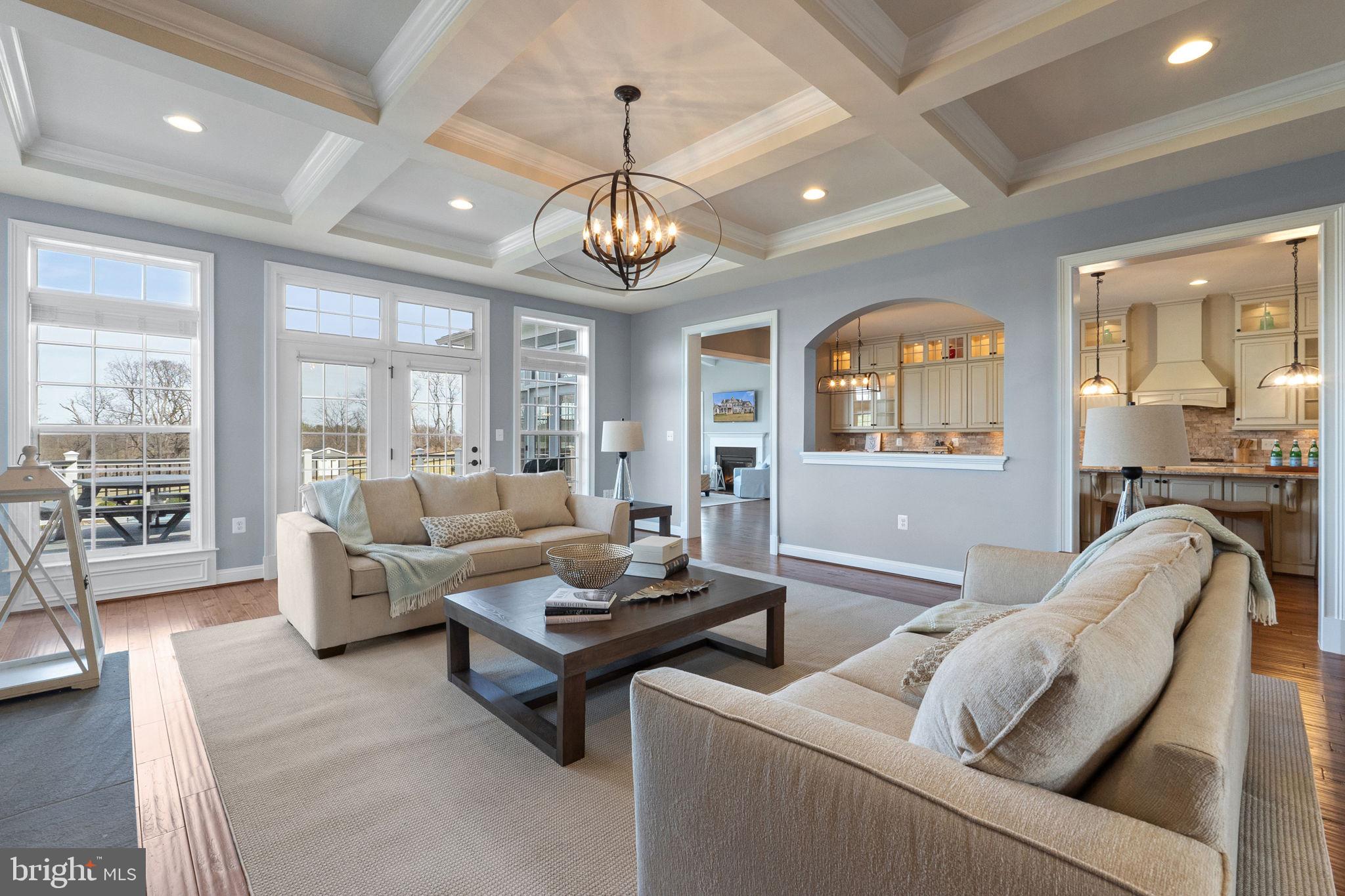 18482 Wild Raspberry Drive Purcellville, VA 20132 - Photo 42 of 143 a living room with furniture chandelier and a large window