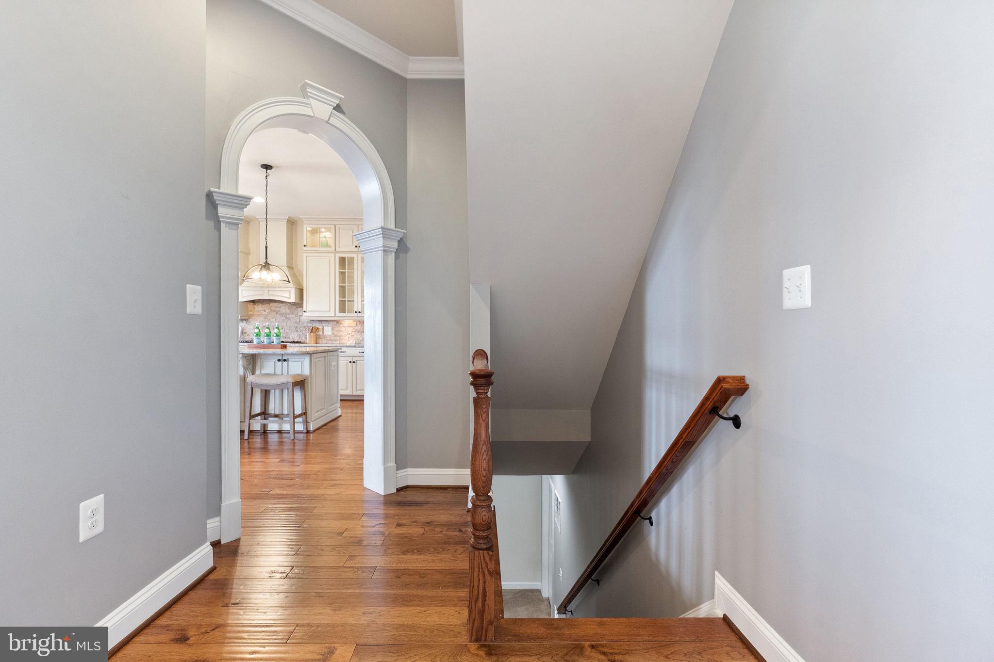 18482 Wild Raspberry Drive Purcellville, VA 20132 - Photo 45 of 143 from foyer to kitchen and stairs to lower level