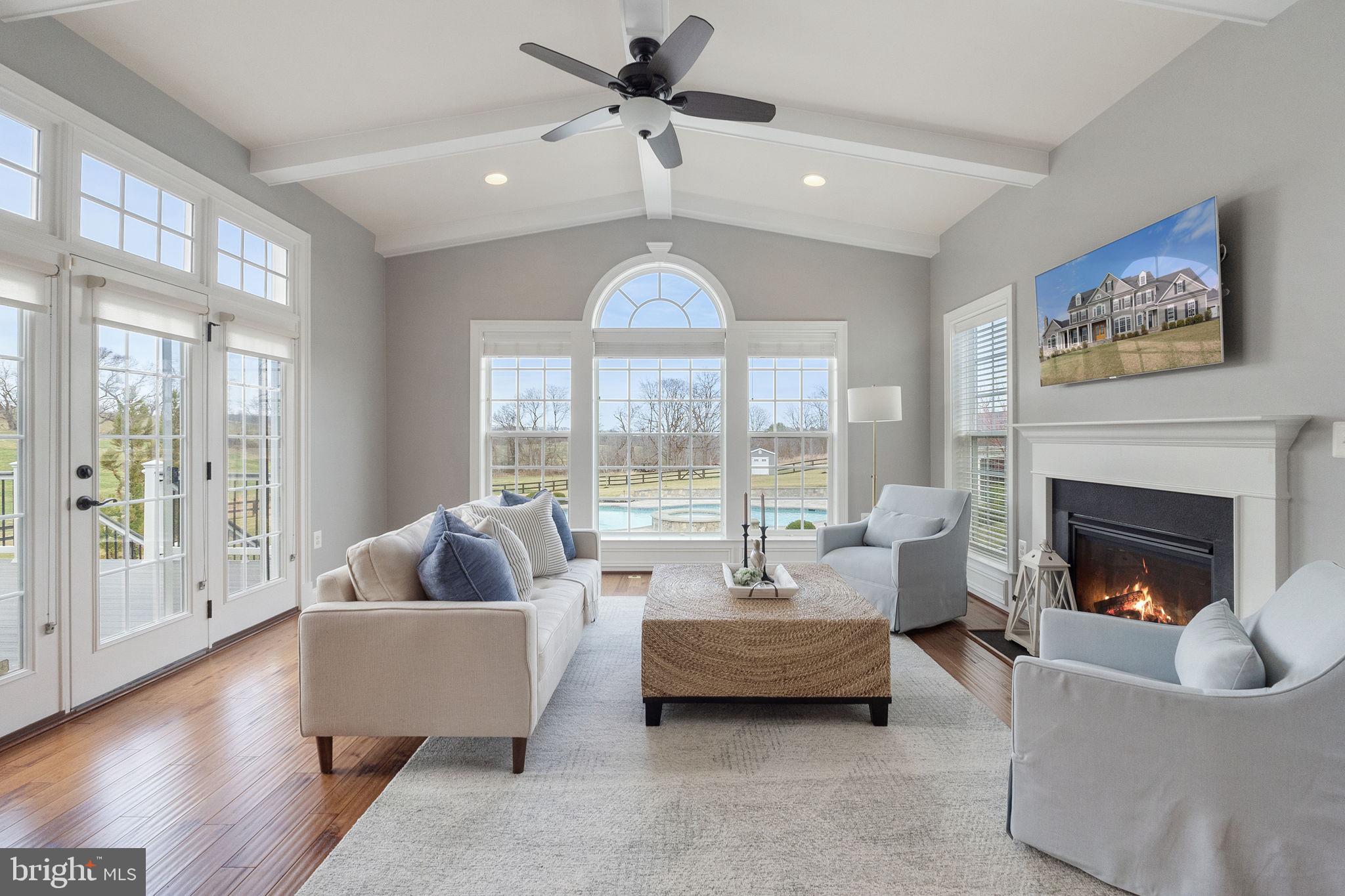 18482 Wild Raspberry Drive Purcellville, VA 20132 - Photo 56 of 143 a living room with furniture and a large window