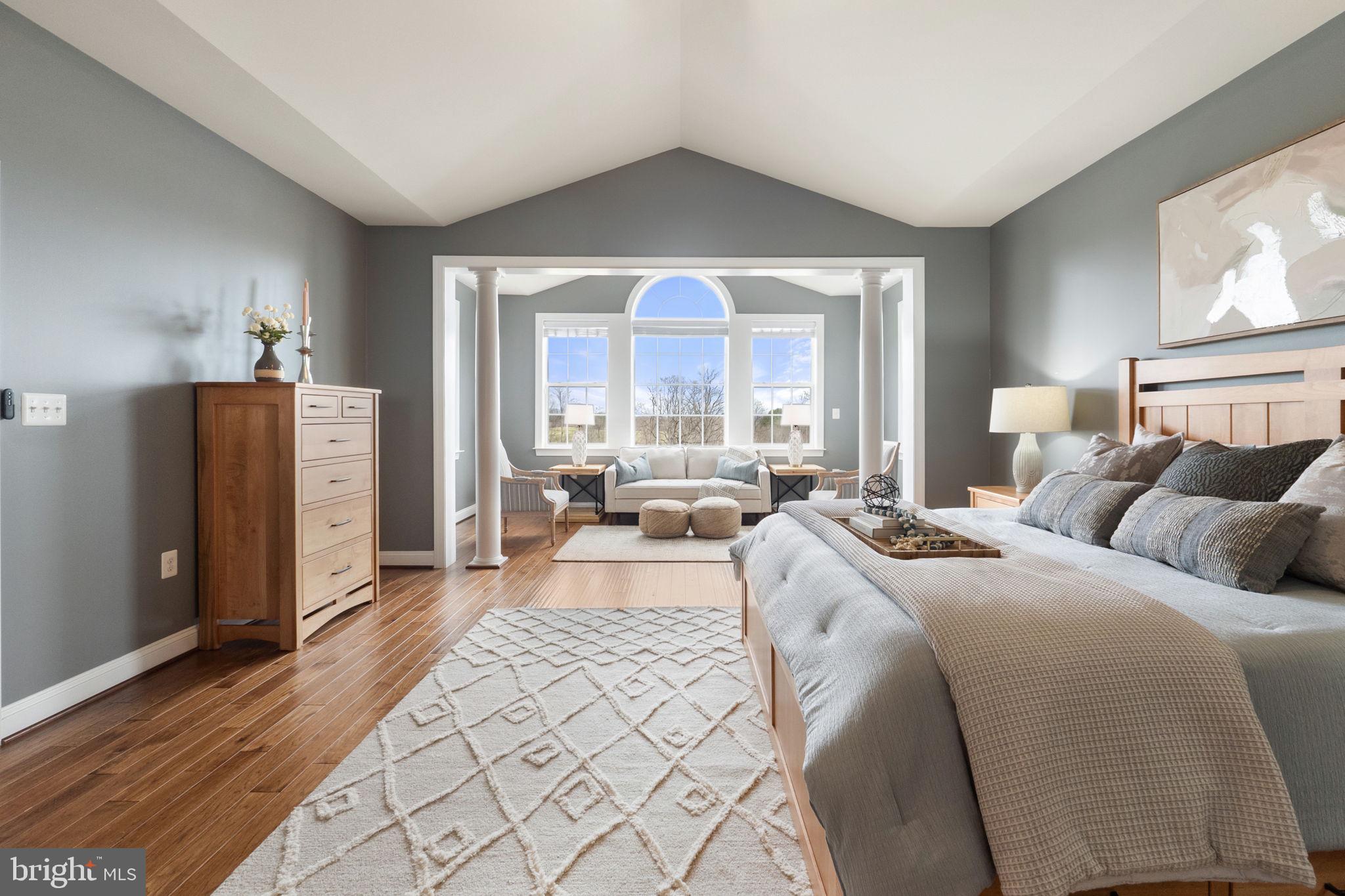 18482 Wild Raspberry Drive Purcellville, VA 20132 - Photo 62 of 143 a bedroom with a large bed and a large window