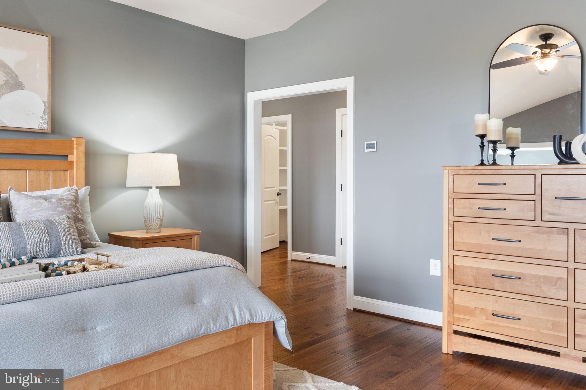 18482 Wild Raspberry Drive Purcellville, VA 20132 - Photo 64 of 143 a bedroom with a bed and a dresser