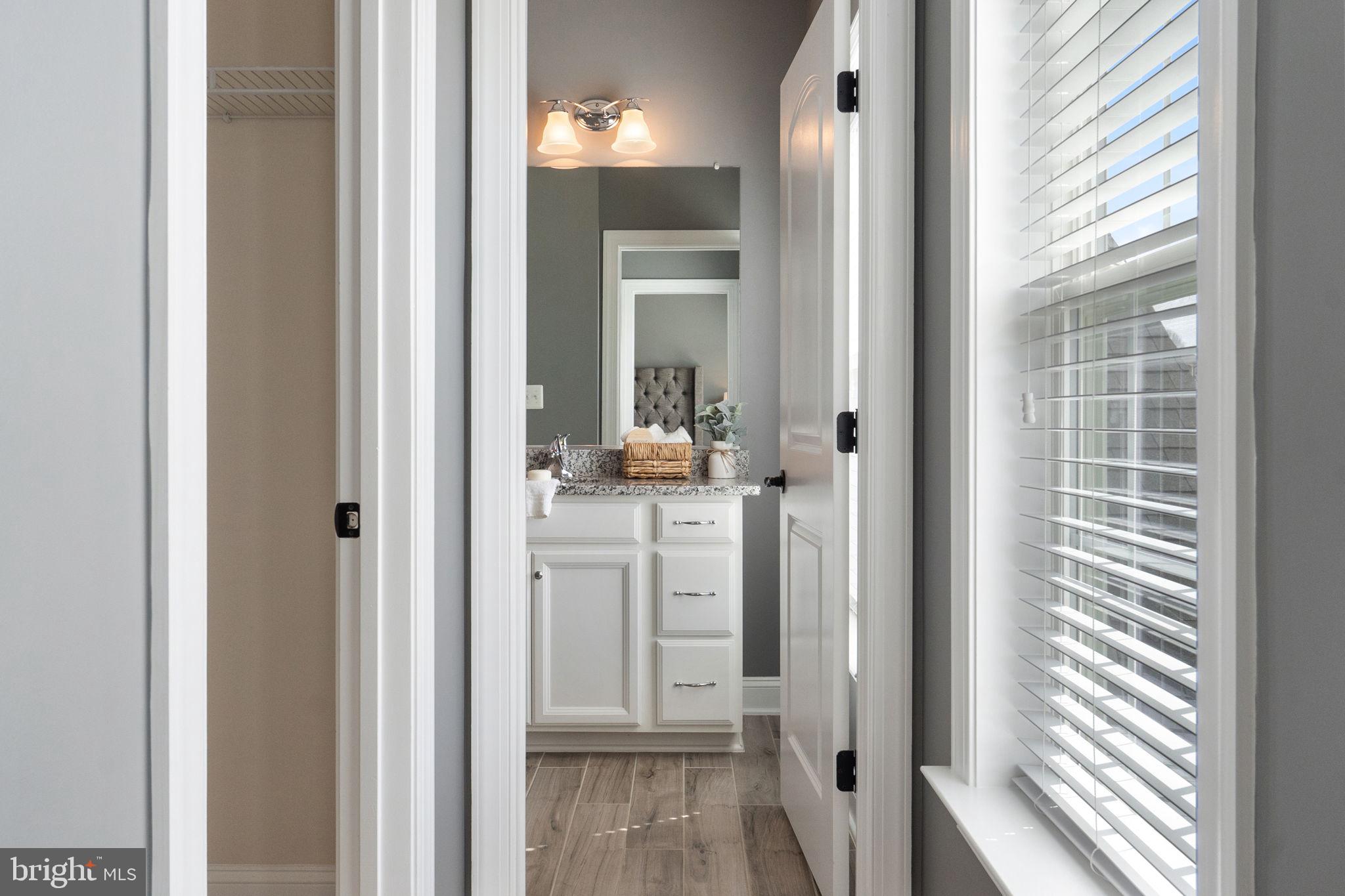 18482 Wild Raspberry Drive Purcellville, VA 20132 - Photo 78 of 143 a view of a bathroom from a hallway