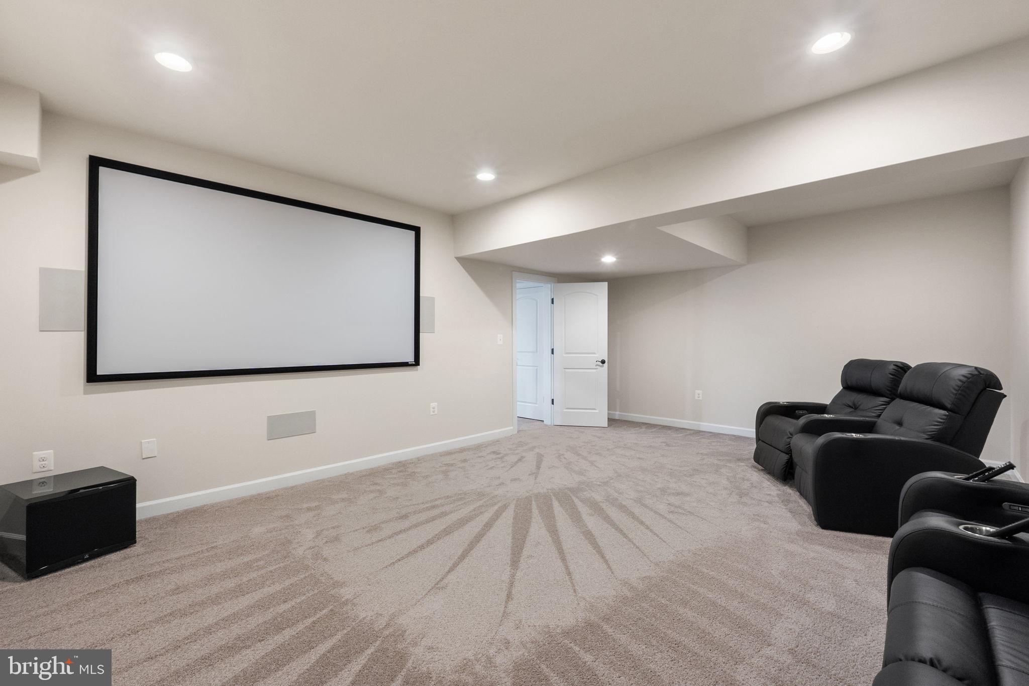 18482 Wild Raspberry Drive Purcellville, VA 20132 - Photo 99 of 143 a living room with furniture and a flat screen tv