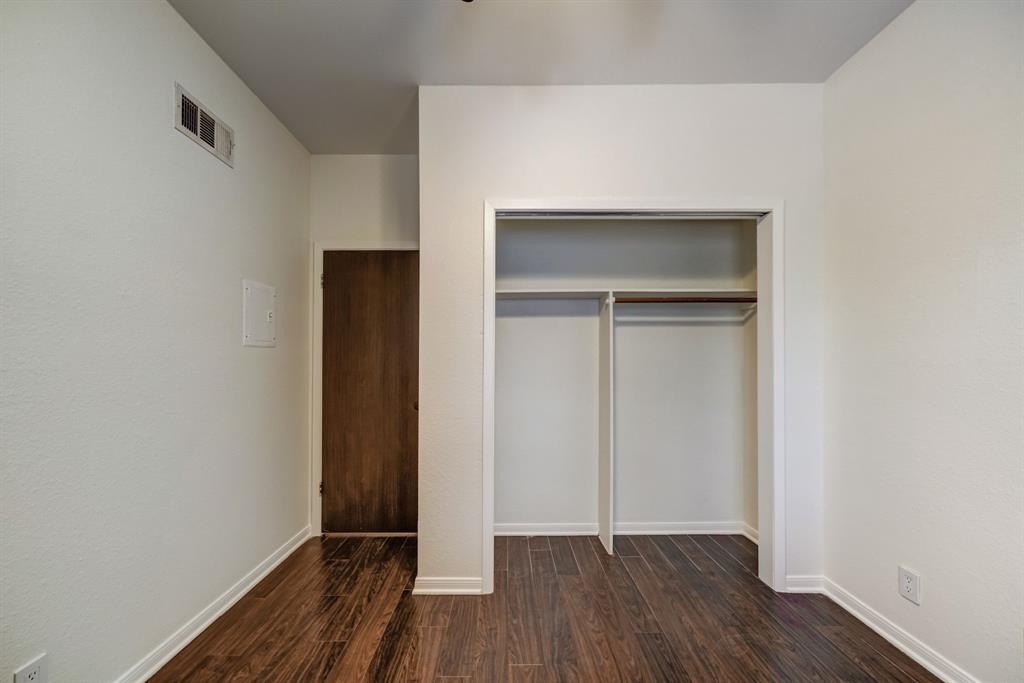 3316 Guadalupe Street, Unit 219 Austin, TX 78705 - Photo 5 of 13 a view of an empty room with wooden floor