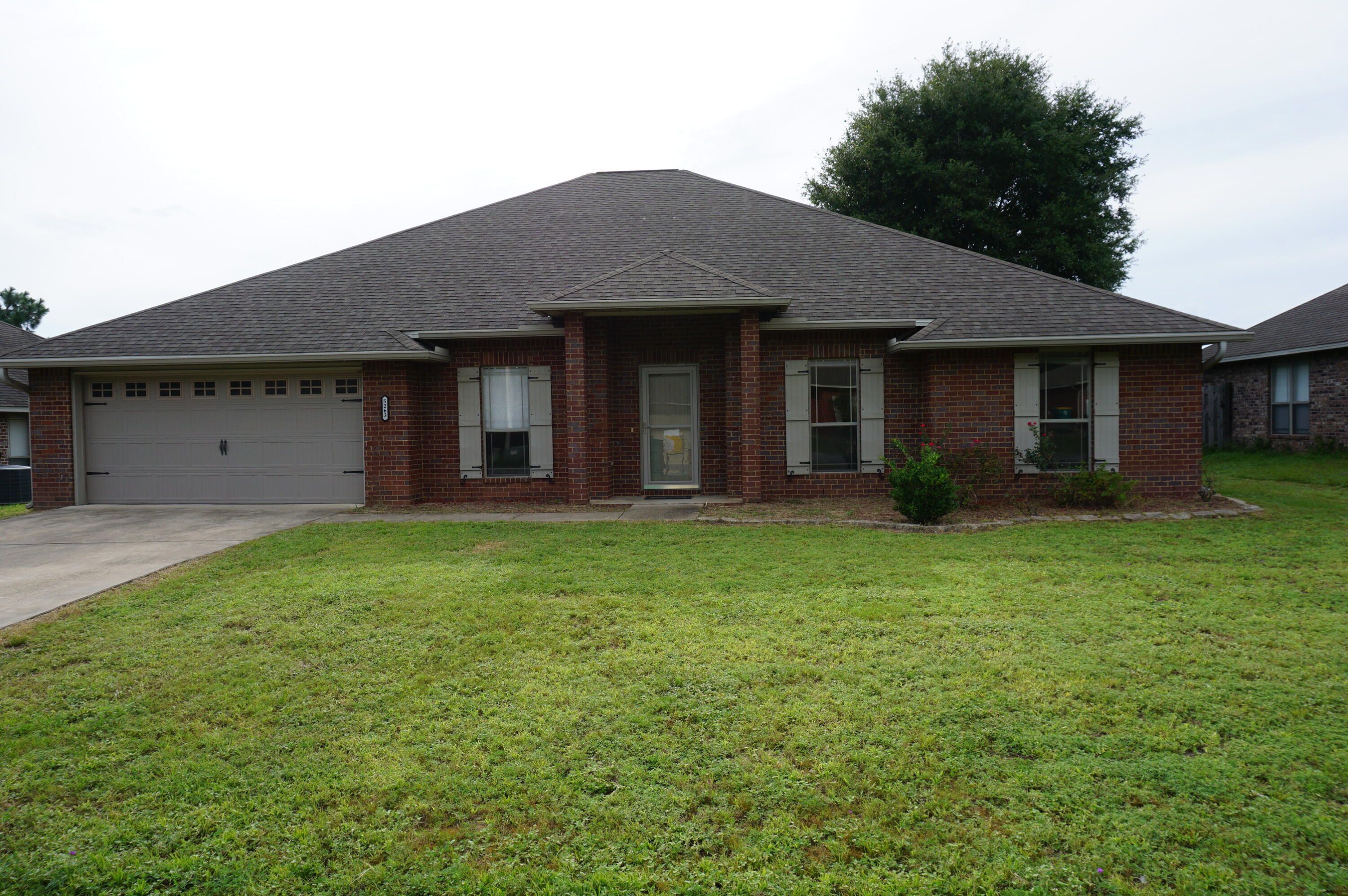 5263 Moore Loop Crestview, FL 32536 - Photo 1 of 37 a view of a house with garden