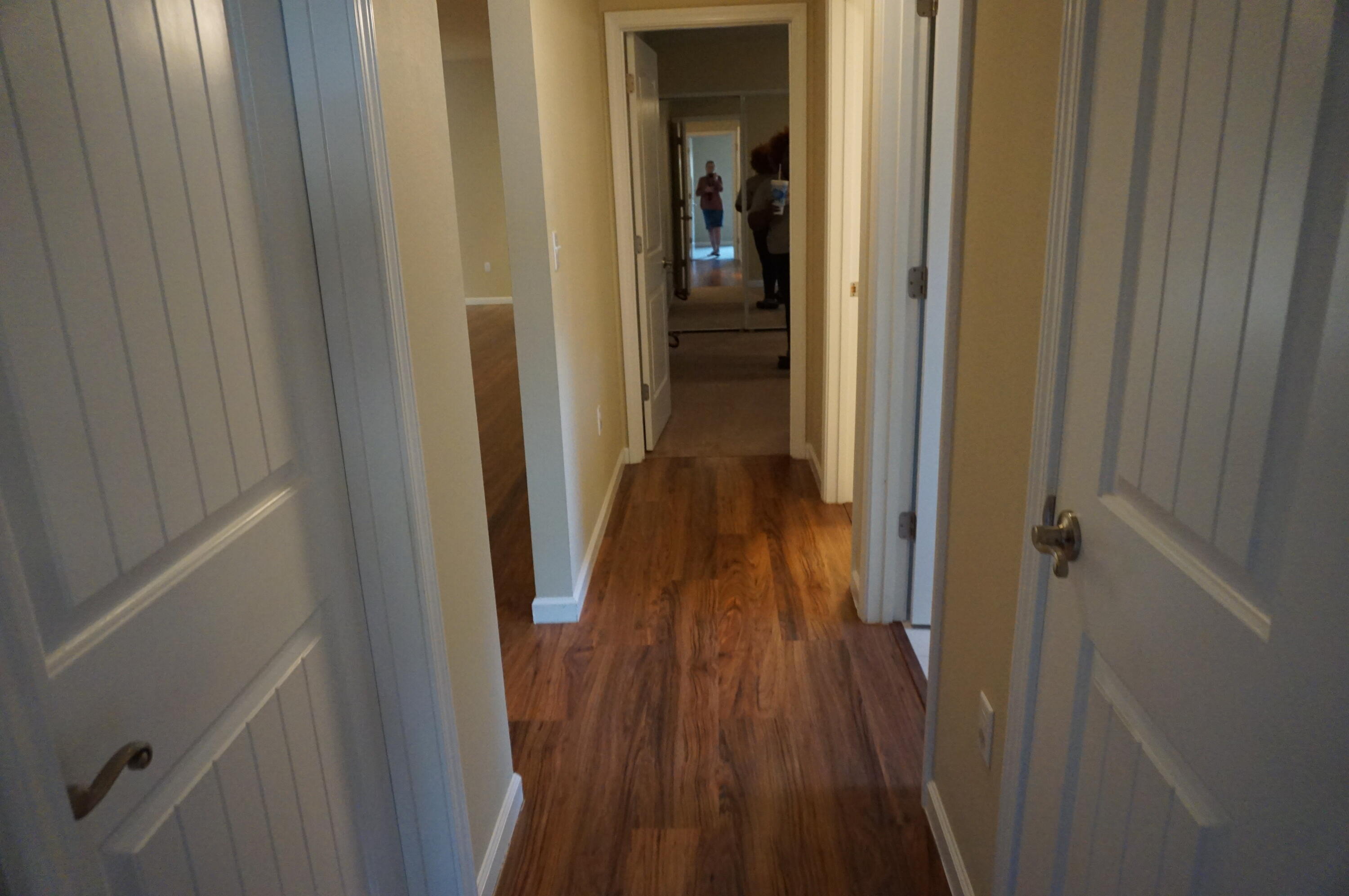 5263 Moore Loop Crestview, FL 32536 - Photo 20 of 37 a view of a hallway with wooden floor