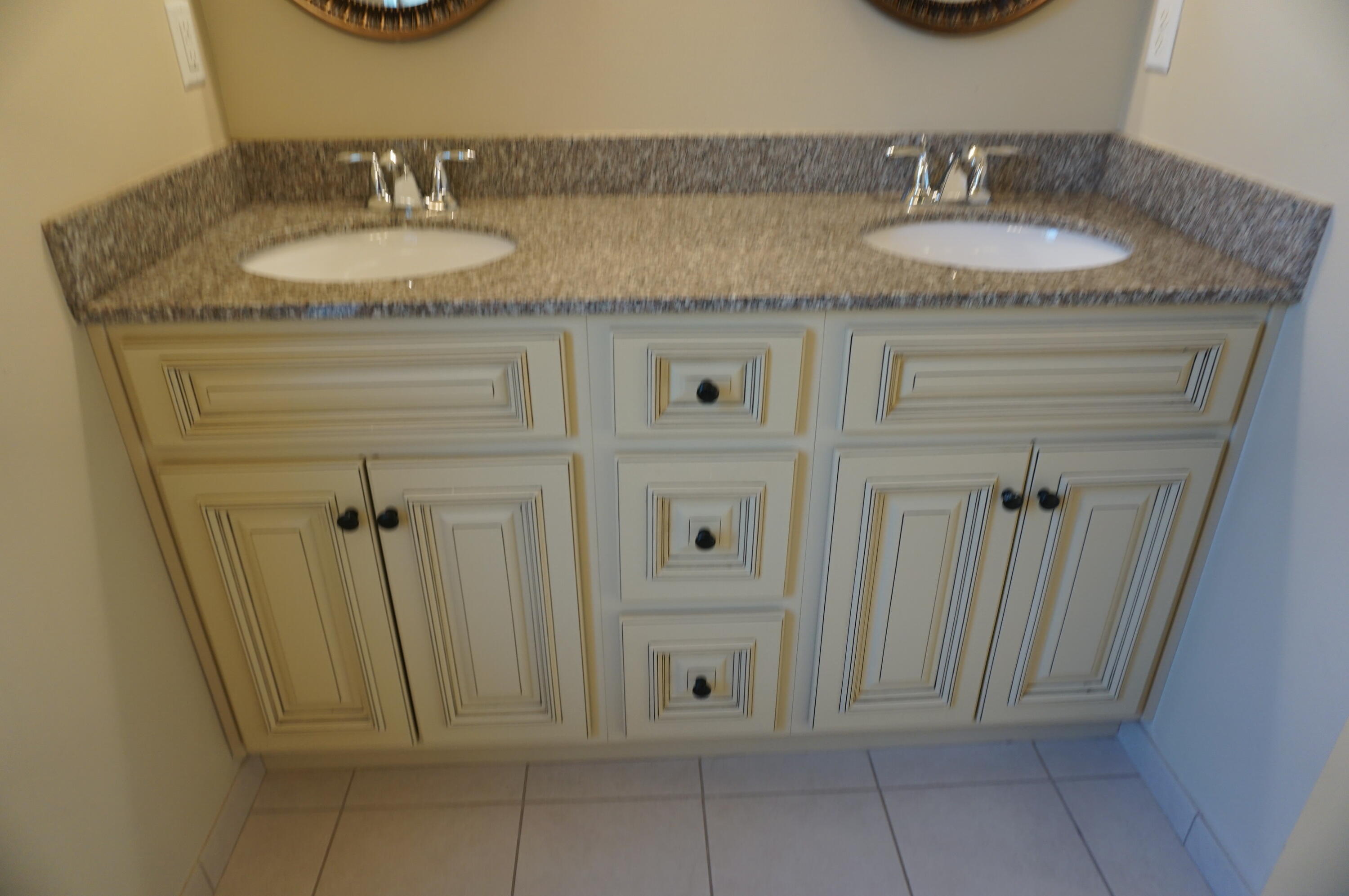 5263 Moore Loop Crestview, FL 32536 - Photo 28 of 37 a bathroom with a granite countertop sink and a mirror