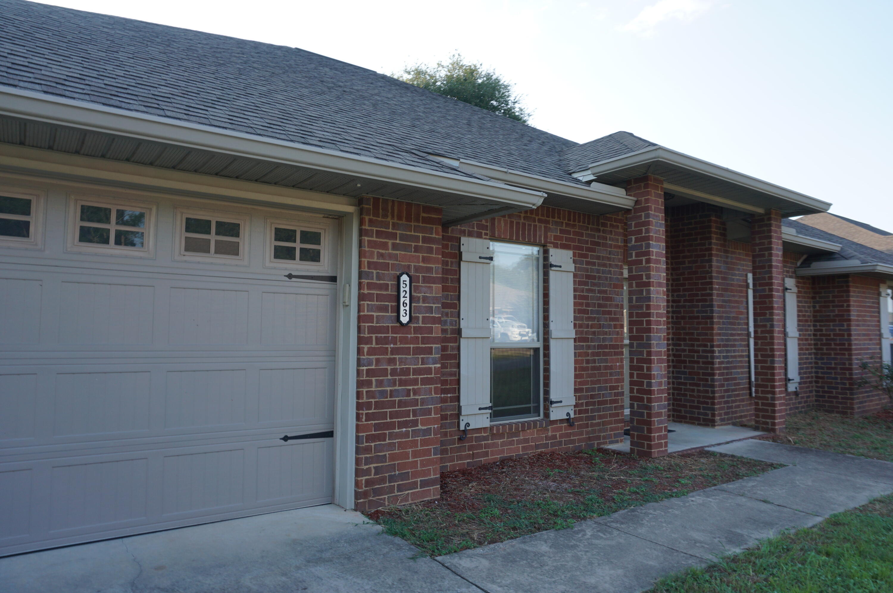 5263 Moore Loop Crestview, FL 32536 - Photo 3 of 37 a front view of a house with a yard
