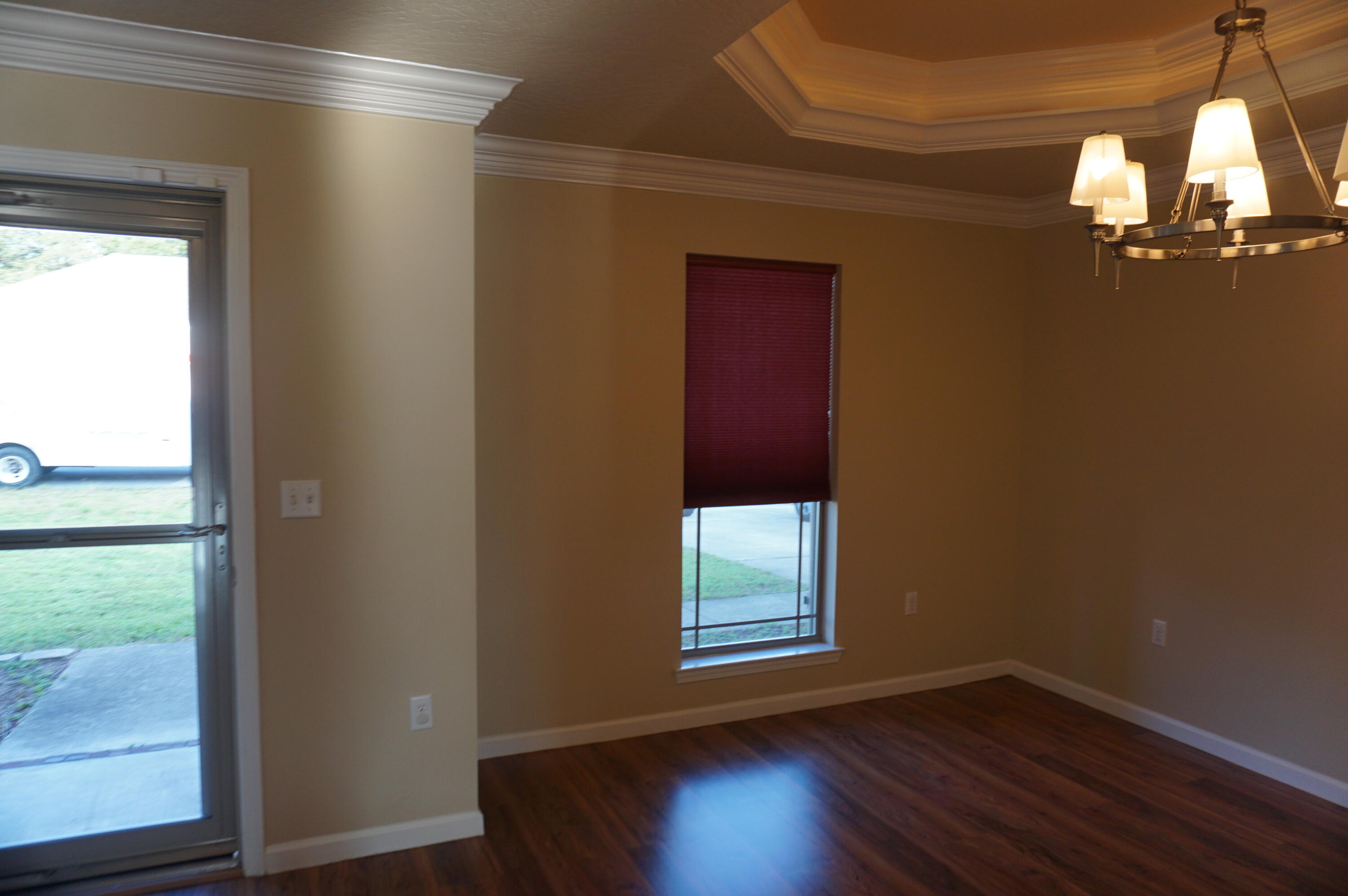 5263 Moore Loop Crestview, FL 32536 - Photo 5 of 37 a view of empty room with wooden floor and fan