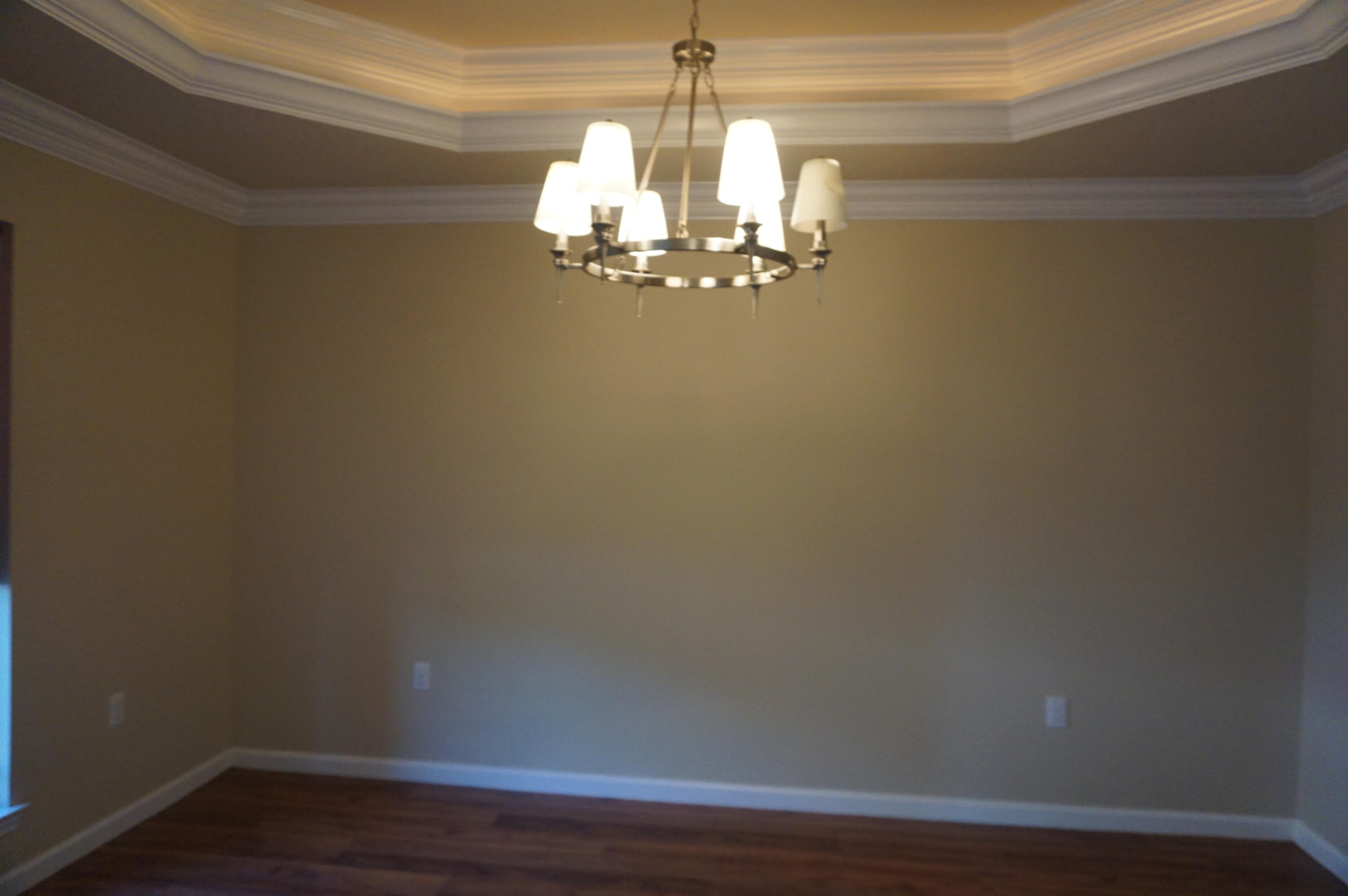 5263 Moore Loop Crestview, FL 32536 - Photo 6 of 37 a view of a chandelier in hallway